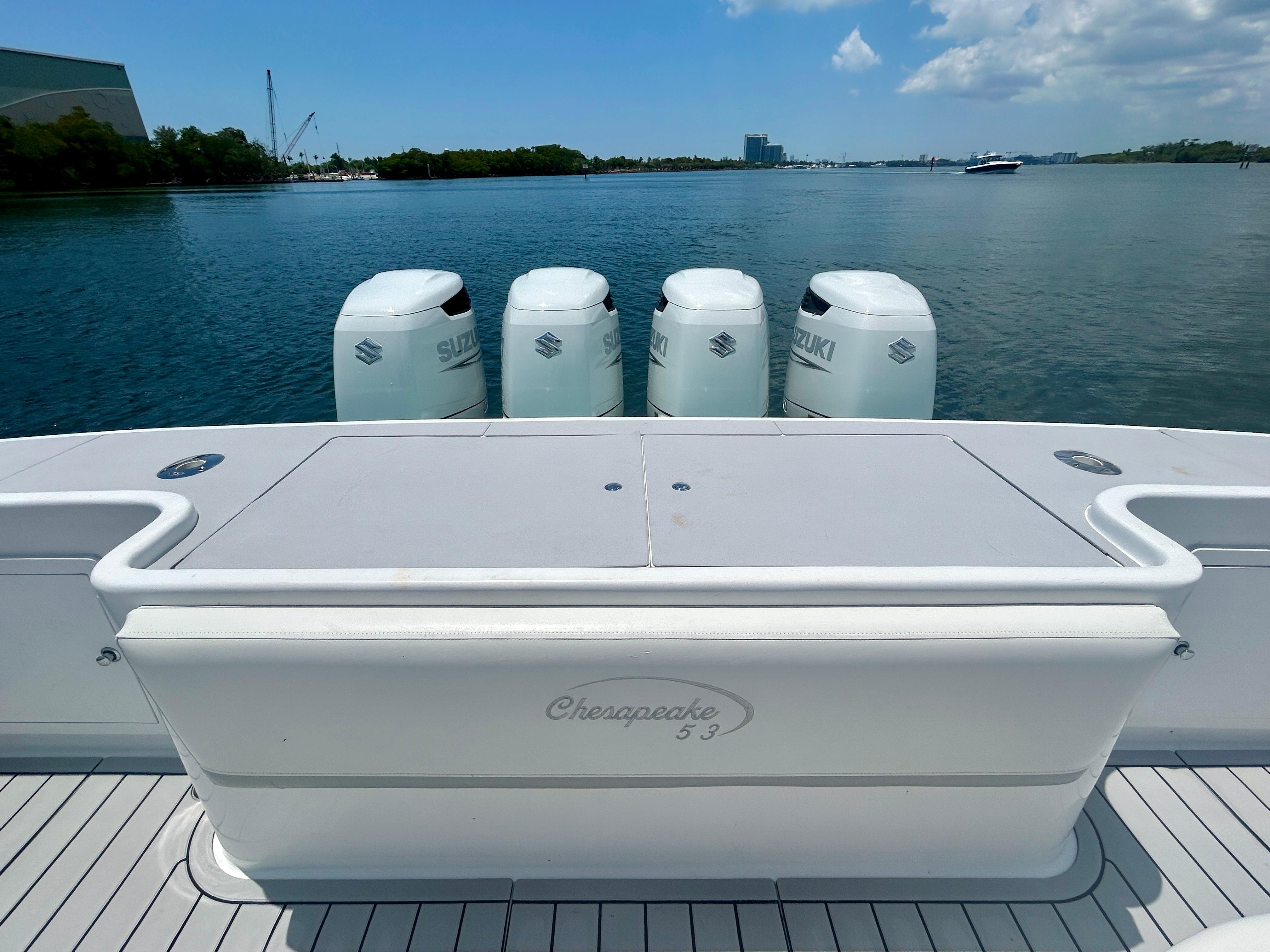 Chesapeake-53 Center Console 2017-Highly Migratory FL-US-2017 Chesapeake 53 Center Console boat with four Suzuki outboard engines on a calm waterway.-9795522 | Thumbnail