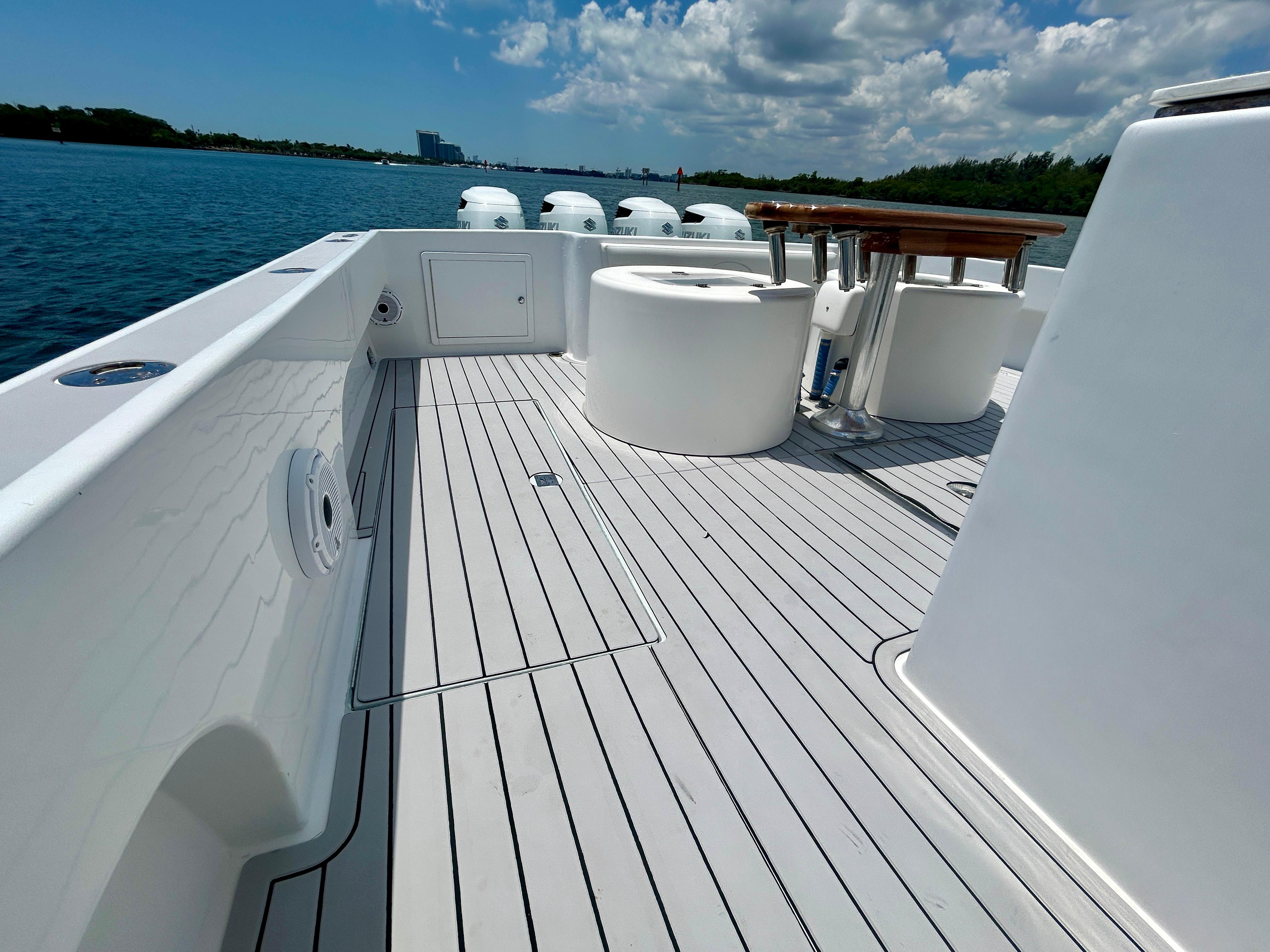 Chesapeake-53 Center Console 2017-Highly Migratory FL-US-2017 Chesapeake 53 Center Console boat deck with seating, on a sunny day by the water.-9795522 | Thumbnail