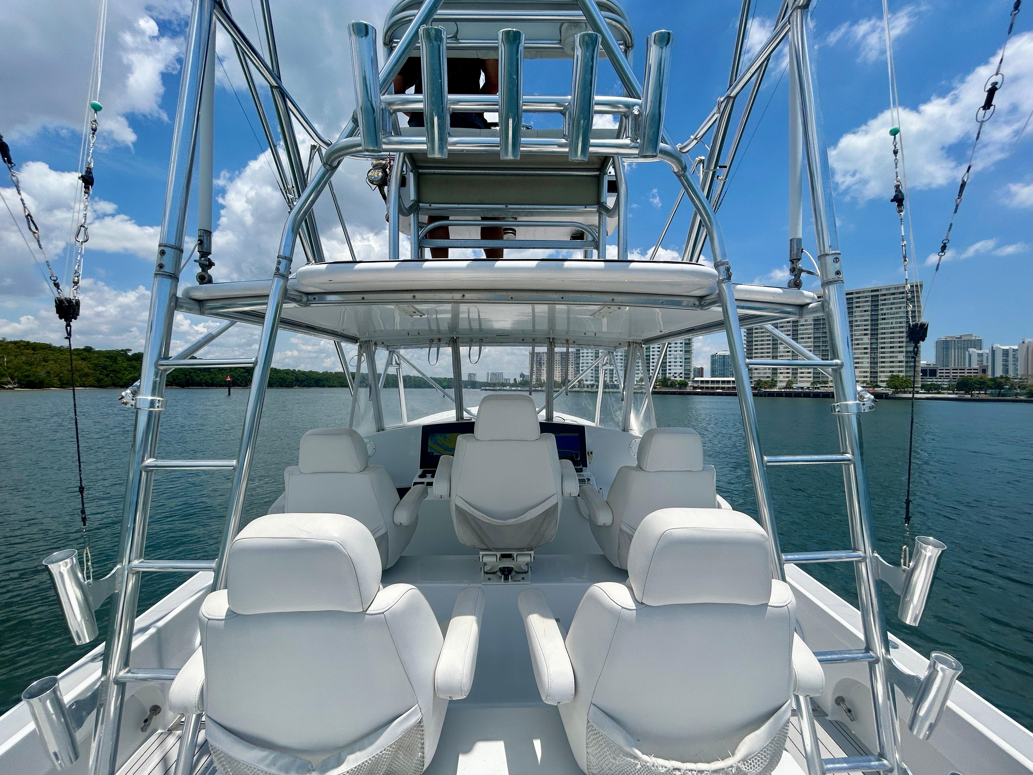 Chesapeake-53 Center Console 2017-Highly Migratory FL-US-2017 Chesapeake 53 Center Console boat with white seating, open water, and city skyline in background.-9795522 | Thumbnail