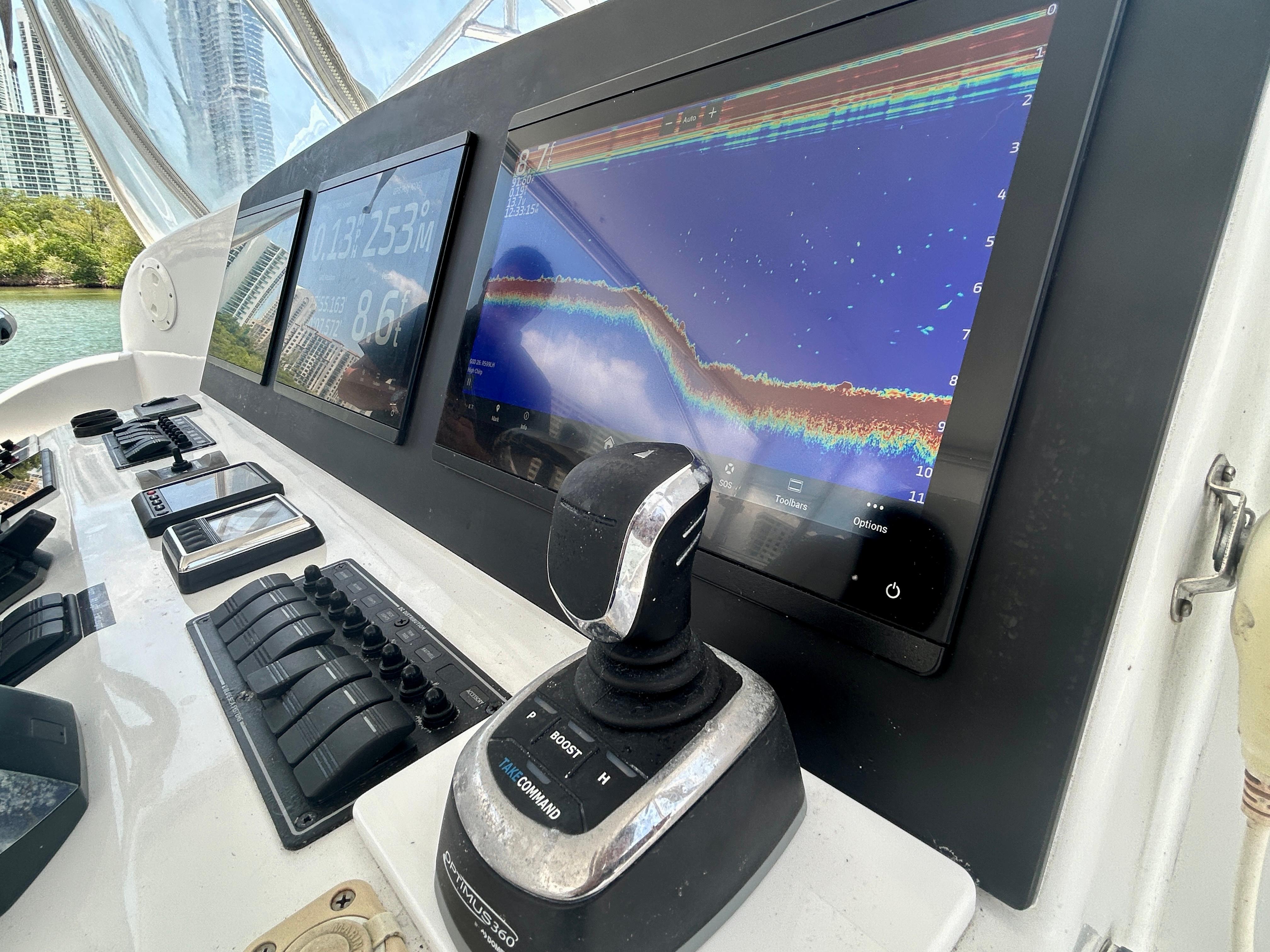 Chesapeake-53 Center Console 2017-Highly Migratory FL-US-2017 Chesapeake 53 Center Console dashboard with navigation screens and controls.-9795522 | Thumbnail