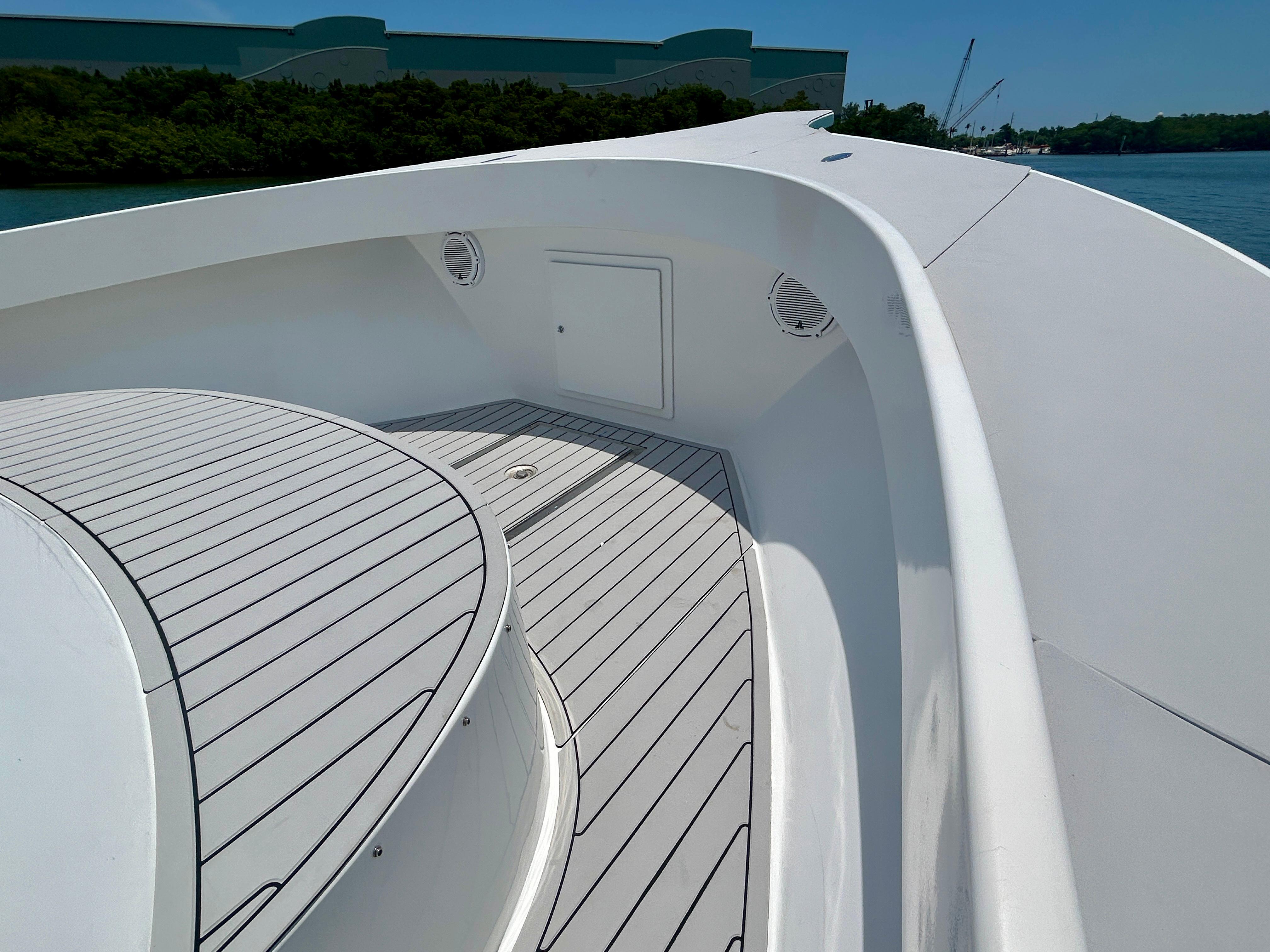 Chesapeake-53 Center Console 2017-Highly Migratory FL-US-2017 Chesapeake 53 Center Console boat deck with sleek white design and wood accents.-9795522 | Thumbnail