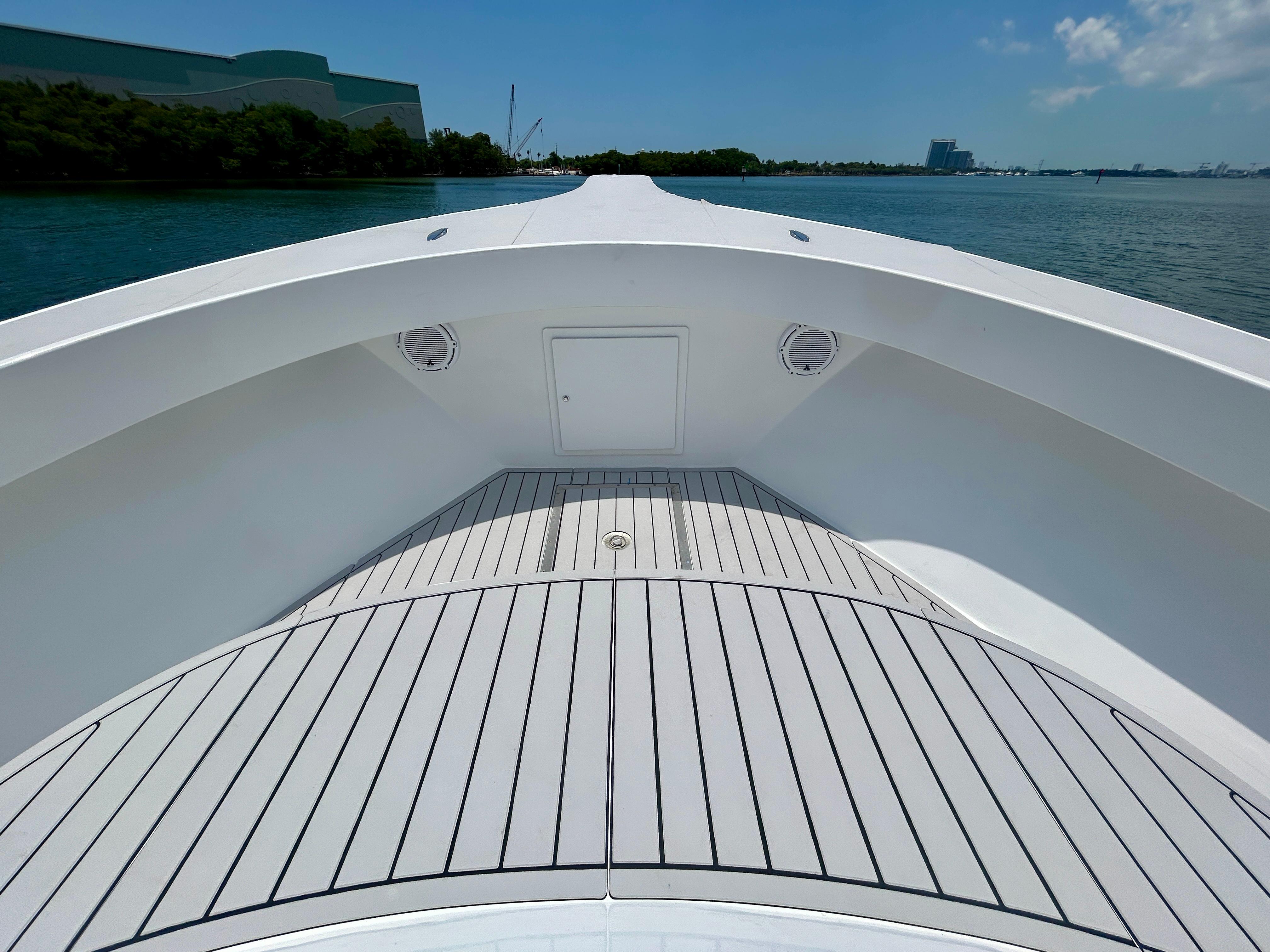 Chesapeake-53 Center Console 2017-Highly Migratory FL-US-2017 Chesapeake 53 Center Console boat deck with sleek design on calm water.-9795522 | Thumbnail