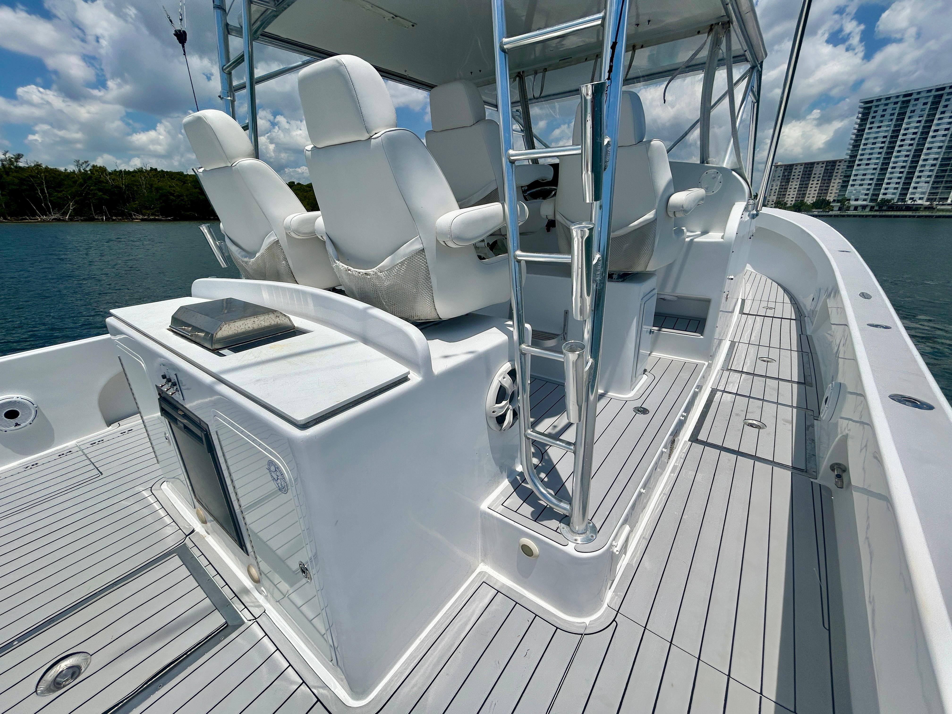 Chesapeake-53 Center Console 2017-Highly Migratory FL-US-2017 Chesapeake 53 Center Console boat with white seating and sleek design on calm water.-9795522 | Thumbnail