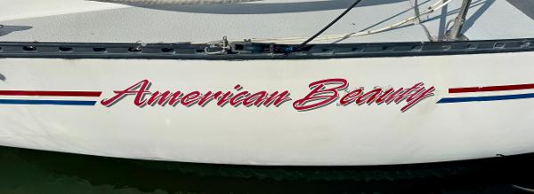 Sailboat "American Beauty" with red, white, and blue stripes, Schock NY 36, 1984 model.