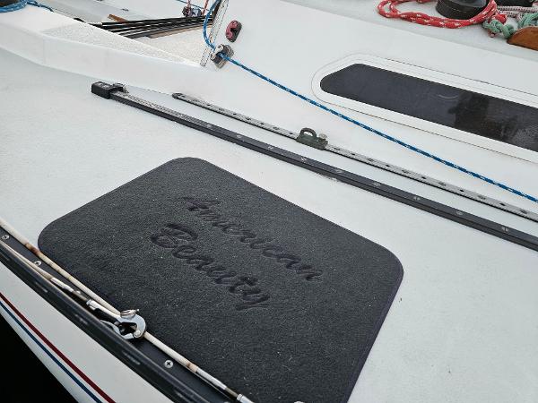 Deck of 1984 Schock NY 36 sailboat with "American Beauty" mat.