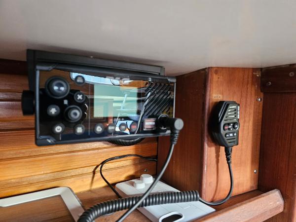Control panel and radio equipment inside a 1984 Schock NY 36 sailboat cabin.
