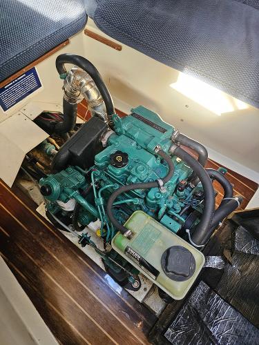 Engine of a 1984 Schock NY 36 sailboat, showing detailed components and layout.