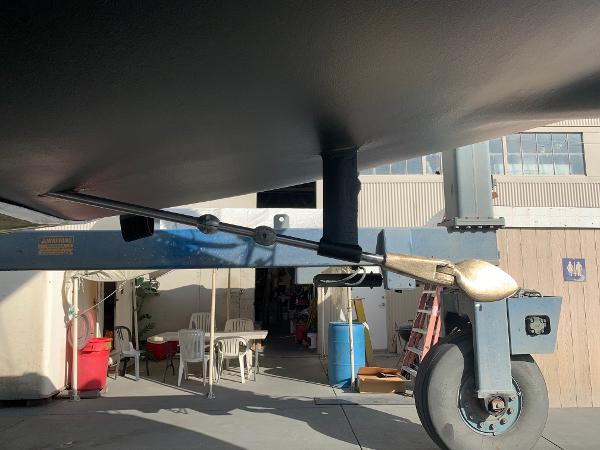 Close-up of Schock NY 36 sailboat's rudder and propeller, 1984 model, in a boatyard.