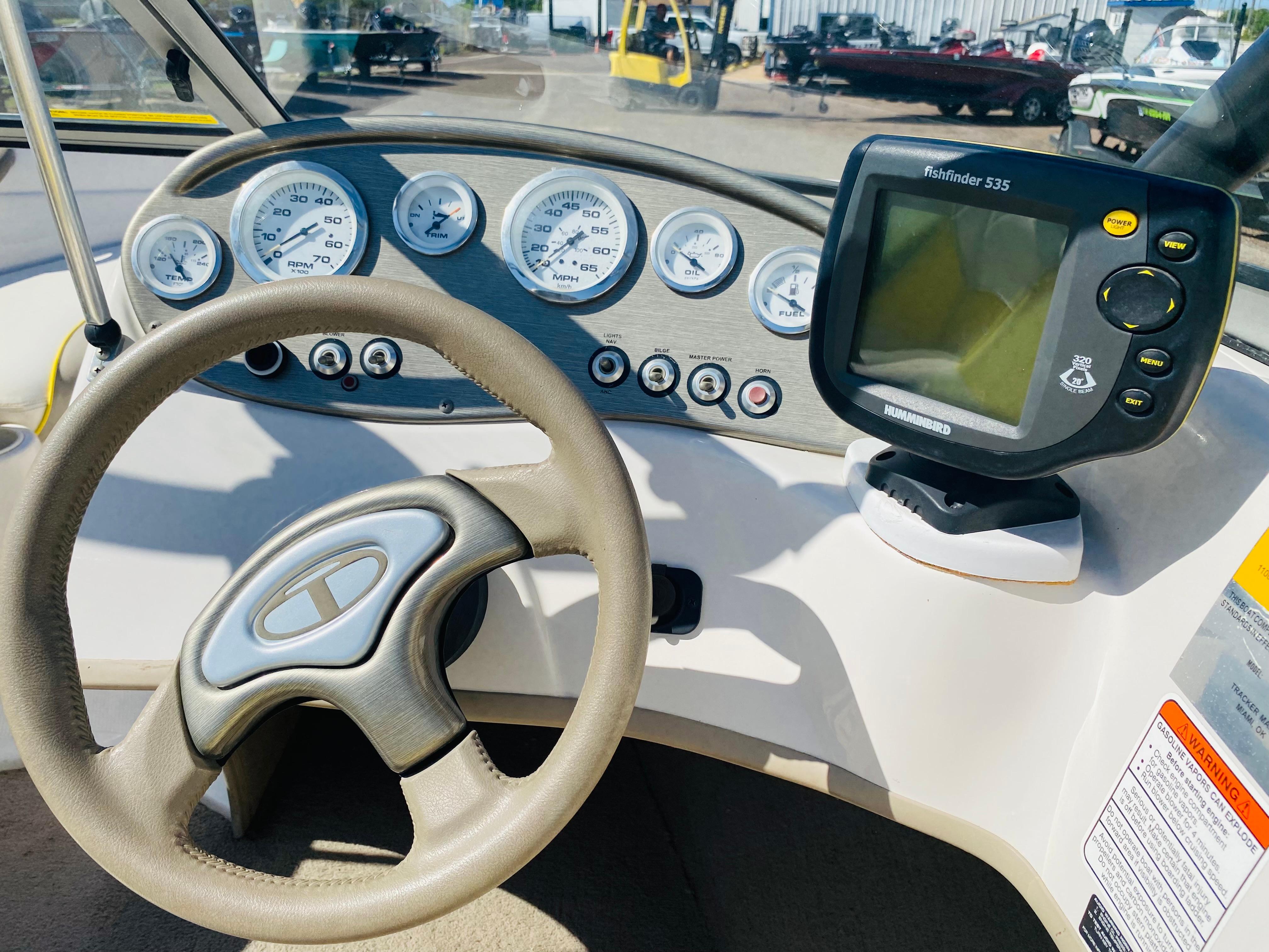2006 Tahoe Q4 Sport dashboard with steering wheel and Humminbird Fishfinder 535.