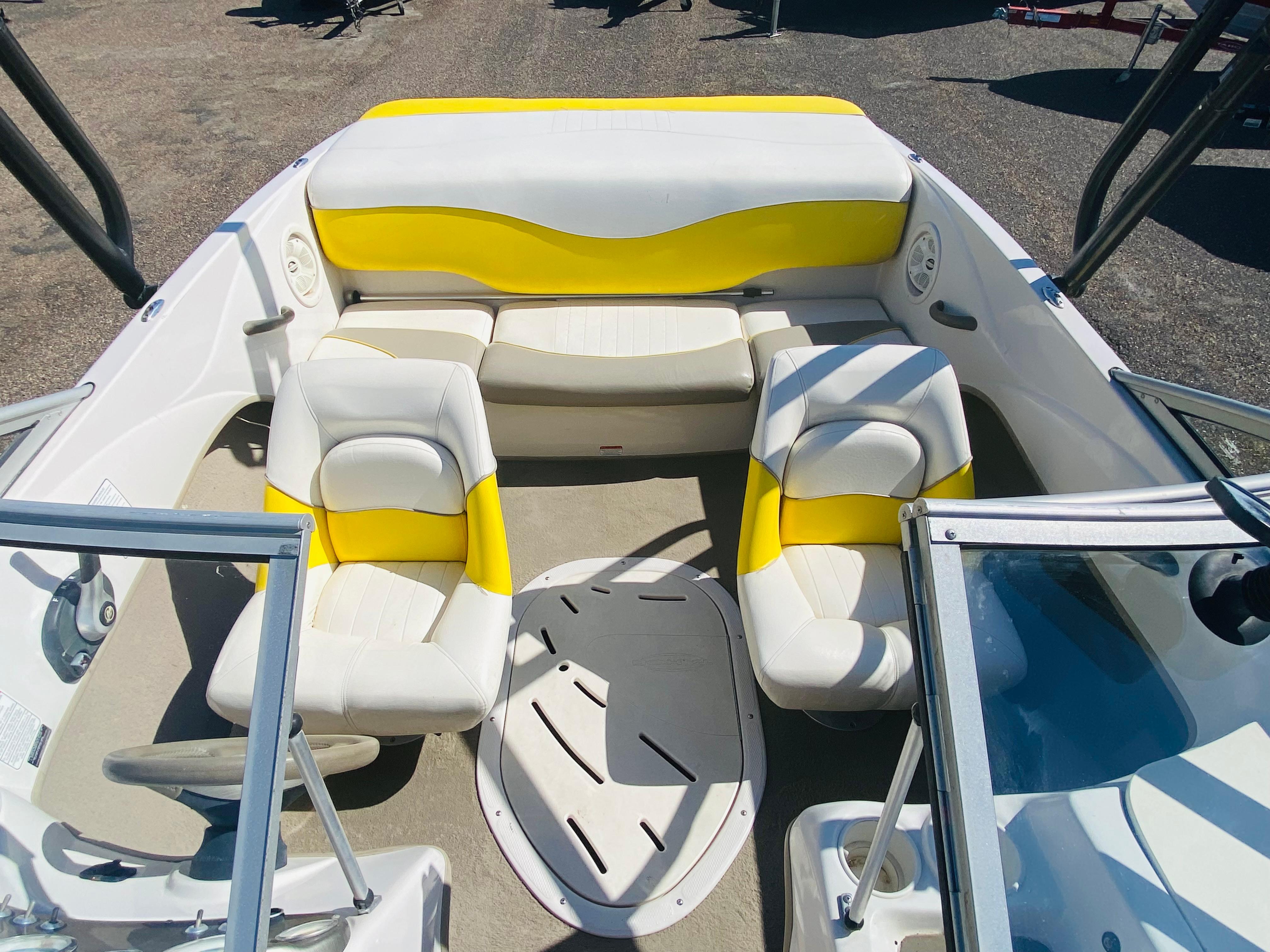 2006 Tahoe Q4 Sport boat interior with yellow and white seating arrangement.