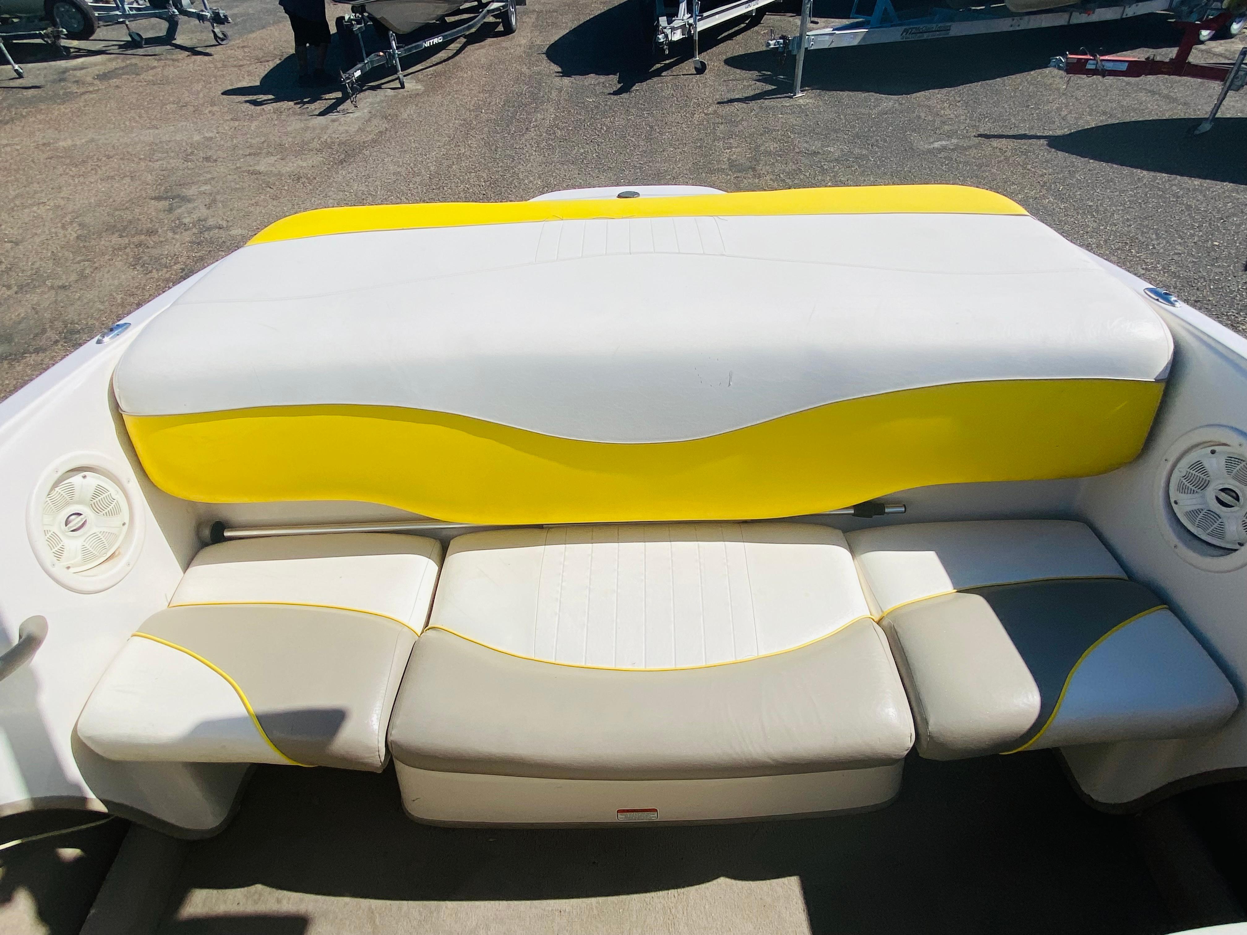 2006 Tahoe Q4 Sport boat interior with yellow and white seating.