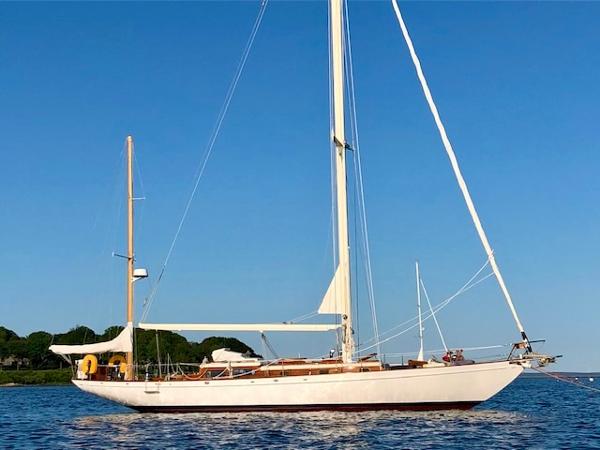 Aage Nielsen 50' Yawl, 1956, sailing on calm waters under clear blue sky.