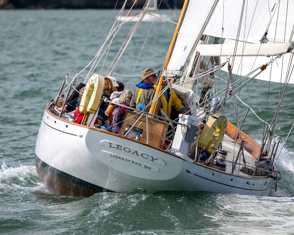 Aage Nielsen 1956 50' Ketch sailing on open water, named "Legacy," with crew onboard.