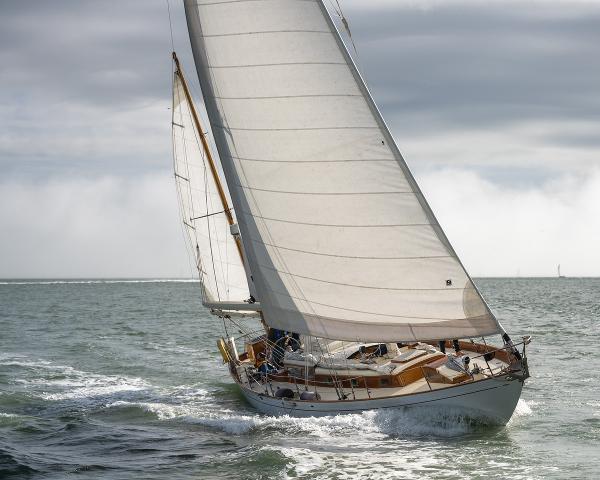 Aage Nielsen 50' Ketch sailing on open sea, 1956 vintage yacht.