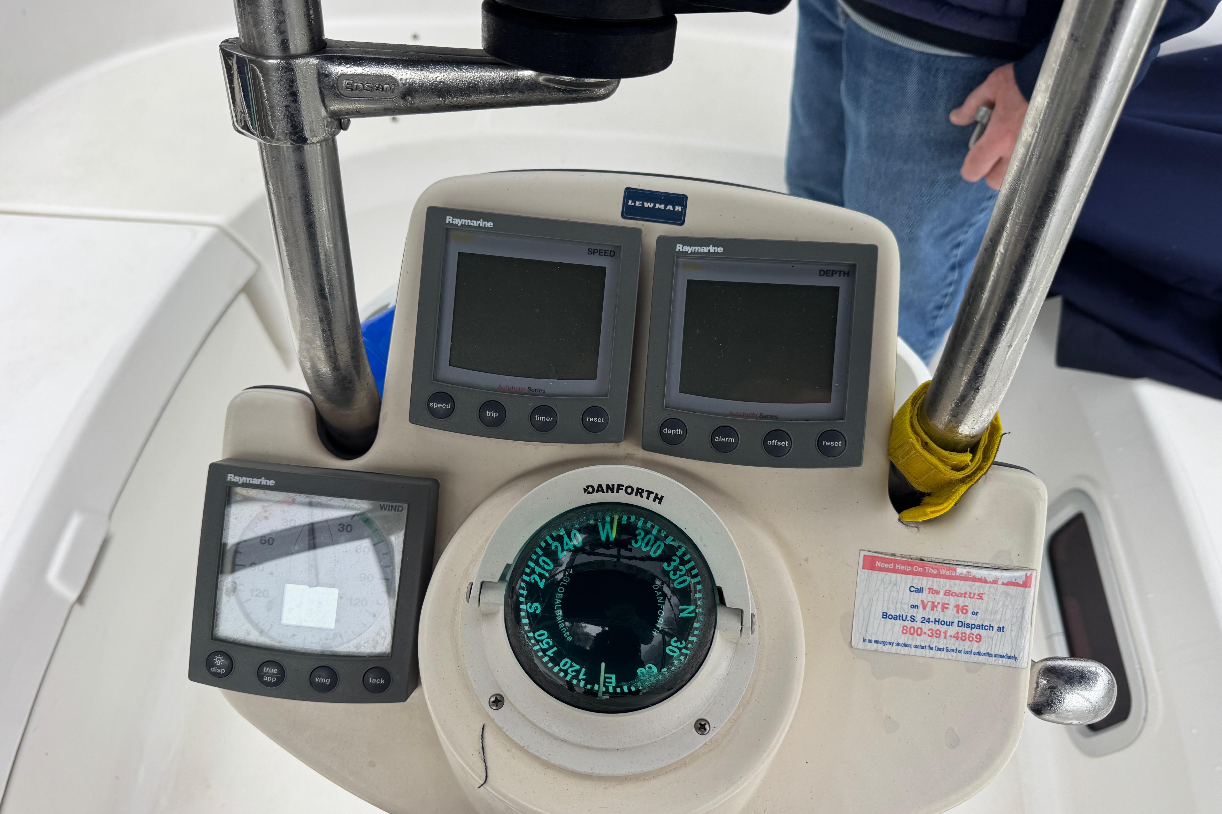 Boat cockpit with Raymarine instruments and Danforth compass on a 2004 Hunter 386 sailboat.
