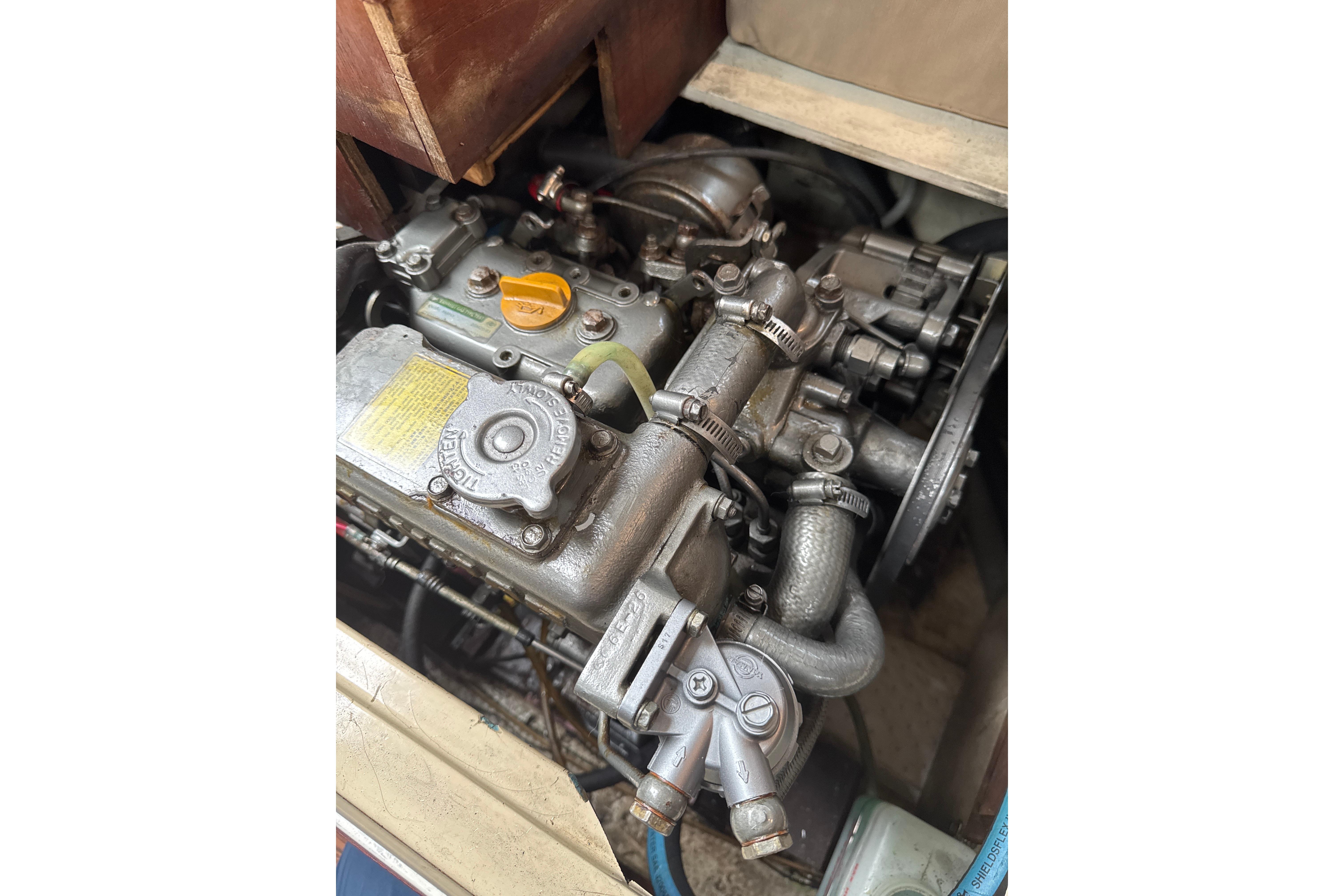 Engine of a 1980 Catalina 30 sailboat, showcasing mechanical components.