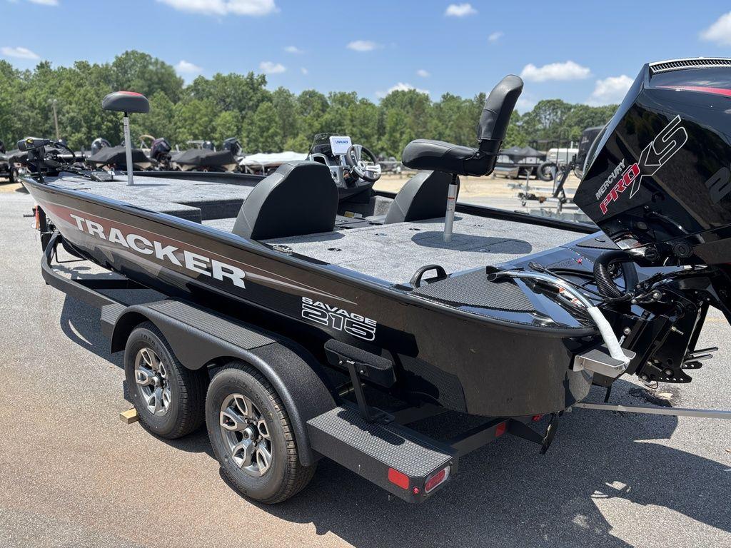 2025 Tracker SAVAGE™ 215 boat on trailer, parked outdoors under clear sky.