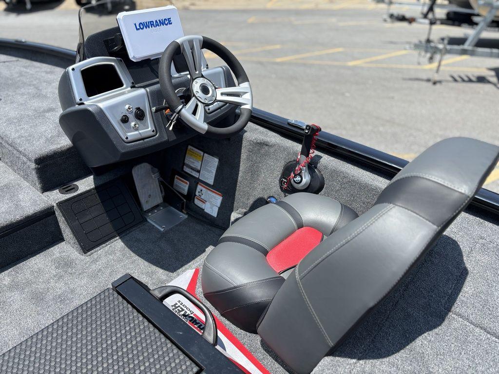 2025 Tracker SAVAGE™ 215 boat cockpit with steering wheel and Lowrance navigation system.