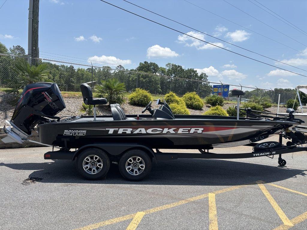 2025 Tracker SAVAGE™ 215 boat on trailer, parked outdoors under clear sky.