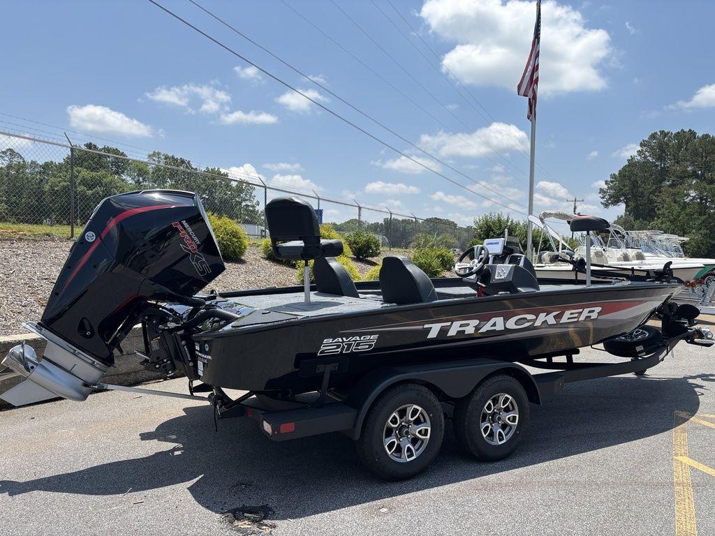 2025 Tracker SAVAGE™ 215 boat on trailer, parked outdoors under a clear sky.