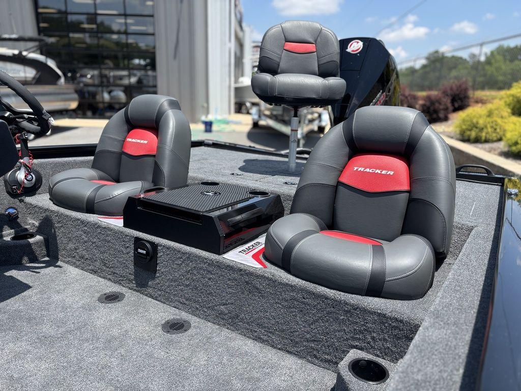 2025 Tracker SAVAGE™ 215 boat interior with gray and red cushioned seats.