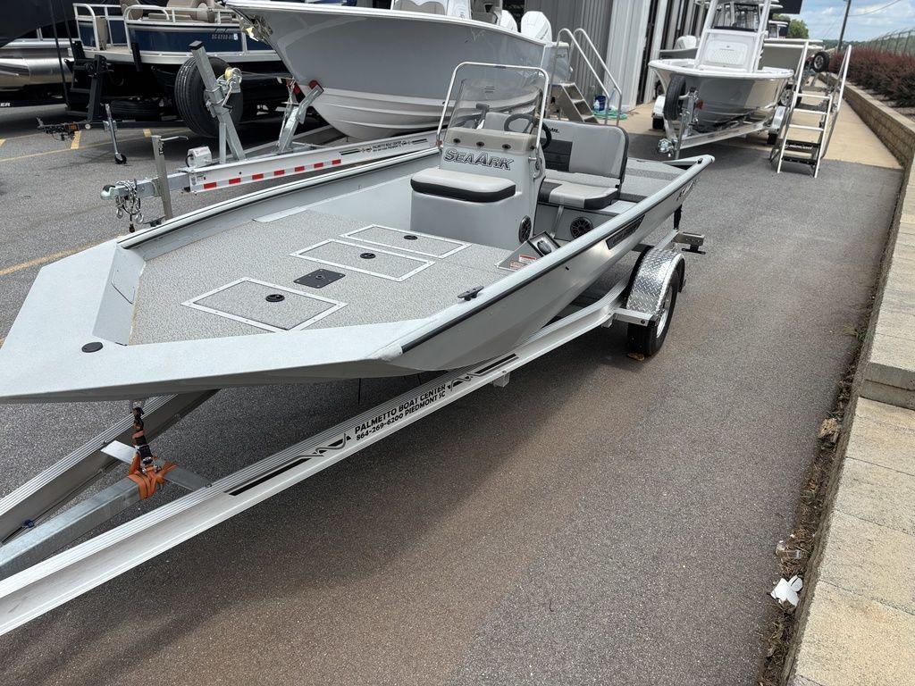 2025 SeaArk Shadow 18 Center Console boat on trailer, parked outdoors.
