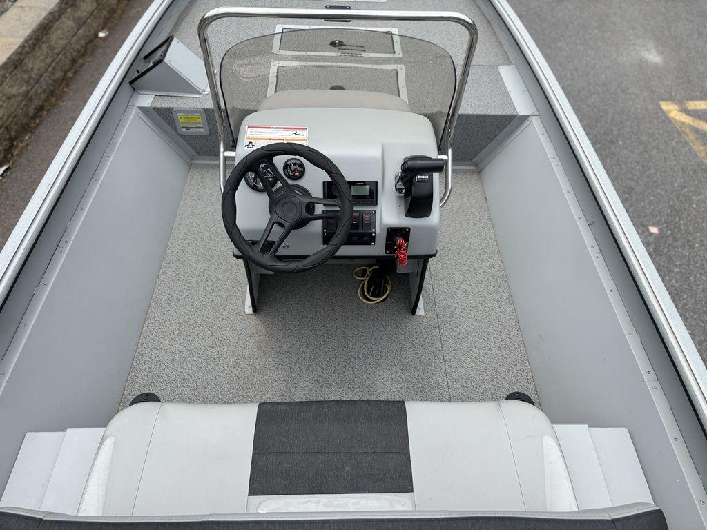 2025 SeaArk Shadow 18 Center Console boat interior with steering wheel and seating.