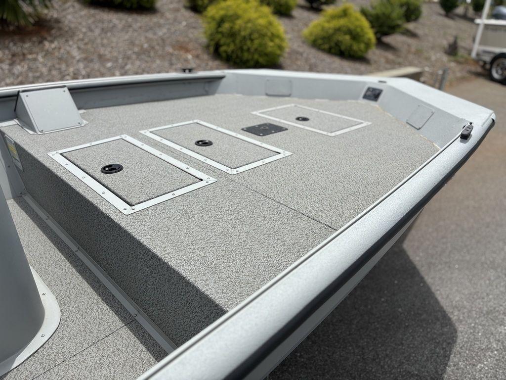 2025 SeaArk Shadow 18 Center Console boat deck with storage compartments.