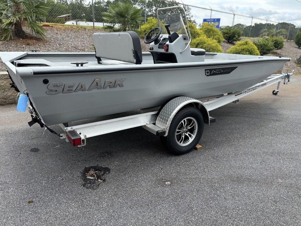 2025 SeaArk Shadow 18 Center Console boat on trailer, parked outdoors.