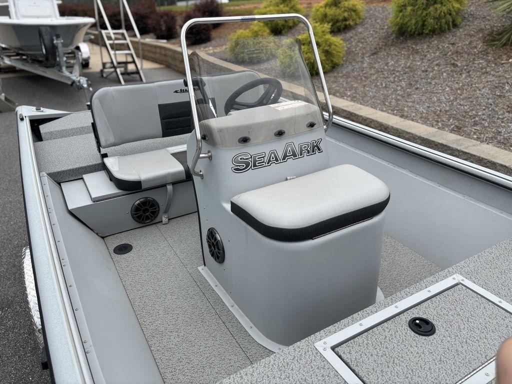 2025 SeaArk Shadow 18 Center Console boat with seating and steering console.