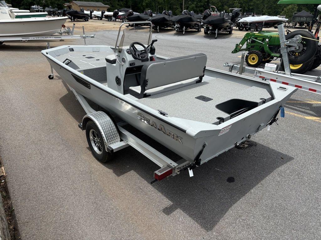 2025 SeaArk Shadow 18 Center Console boat on trailer in outdoor lot.