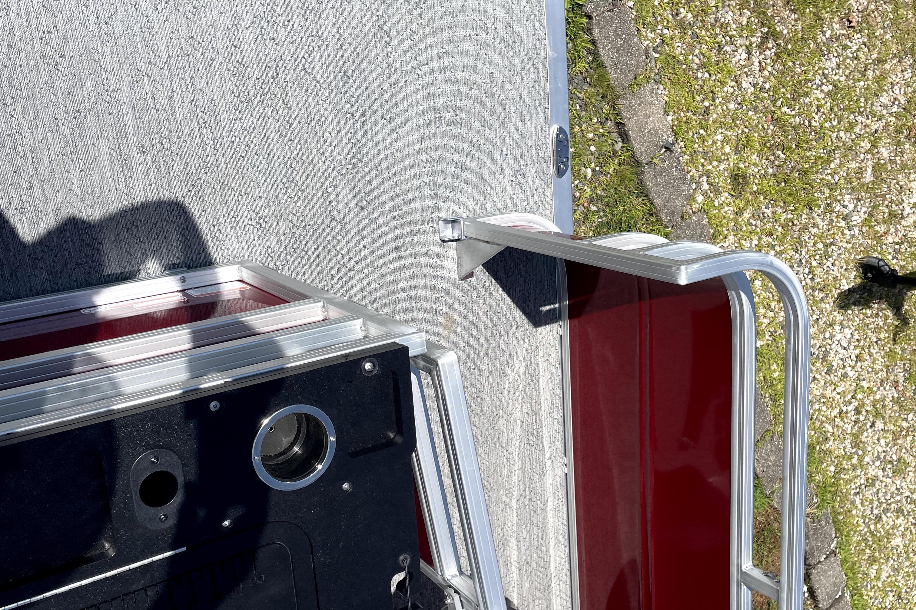 2026 Sun Tracker Fishin' Barge 22 DLX deck and railing detail.