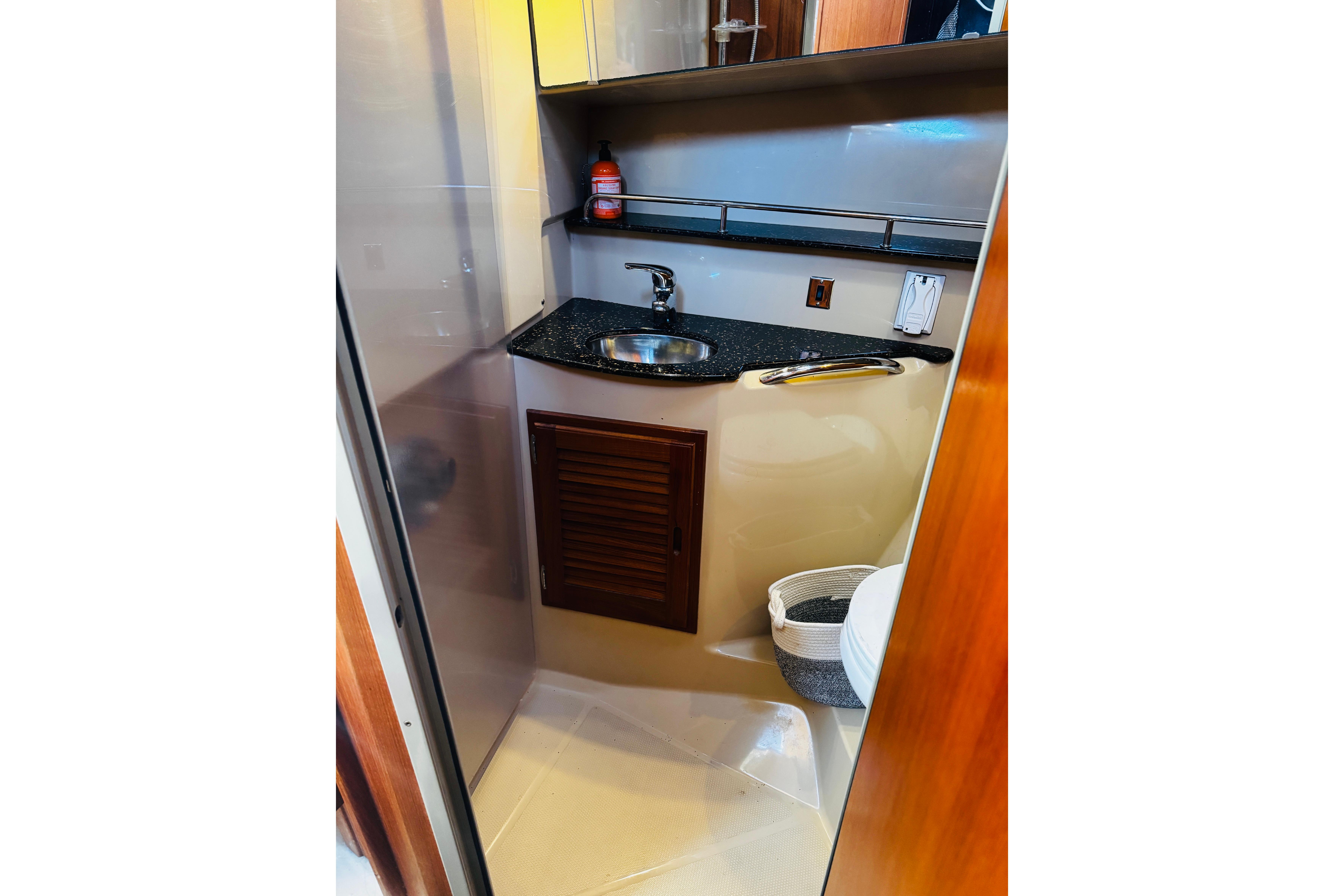 2012 Ranger Tugs R-31 bathroom with sink, countertop, and toilet.