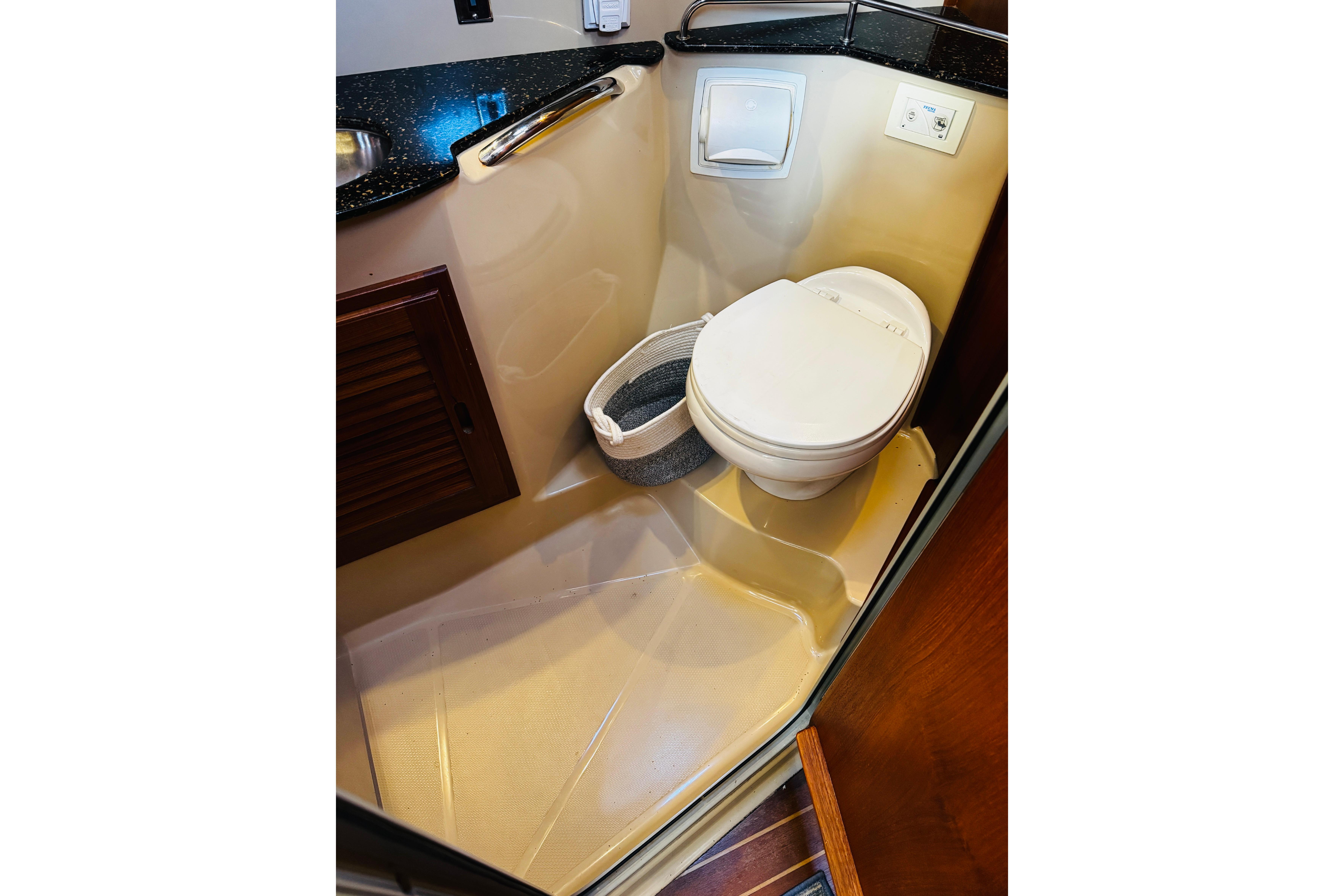 2012 Ranger Tugs R-31 boat bathroom with toilet and sink, compact and efficient design.