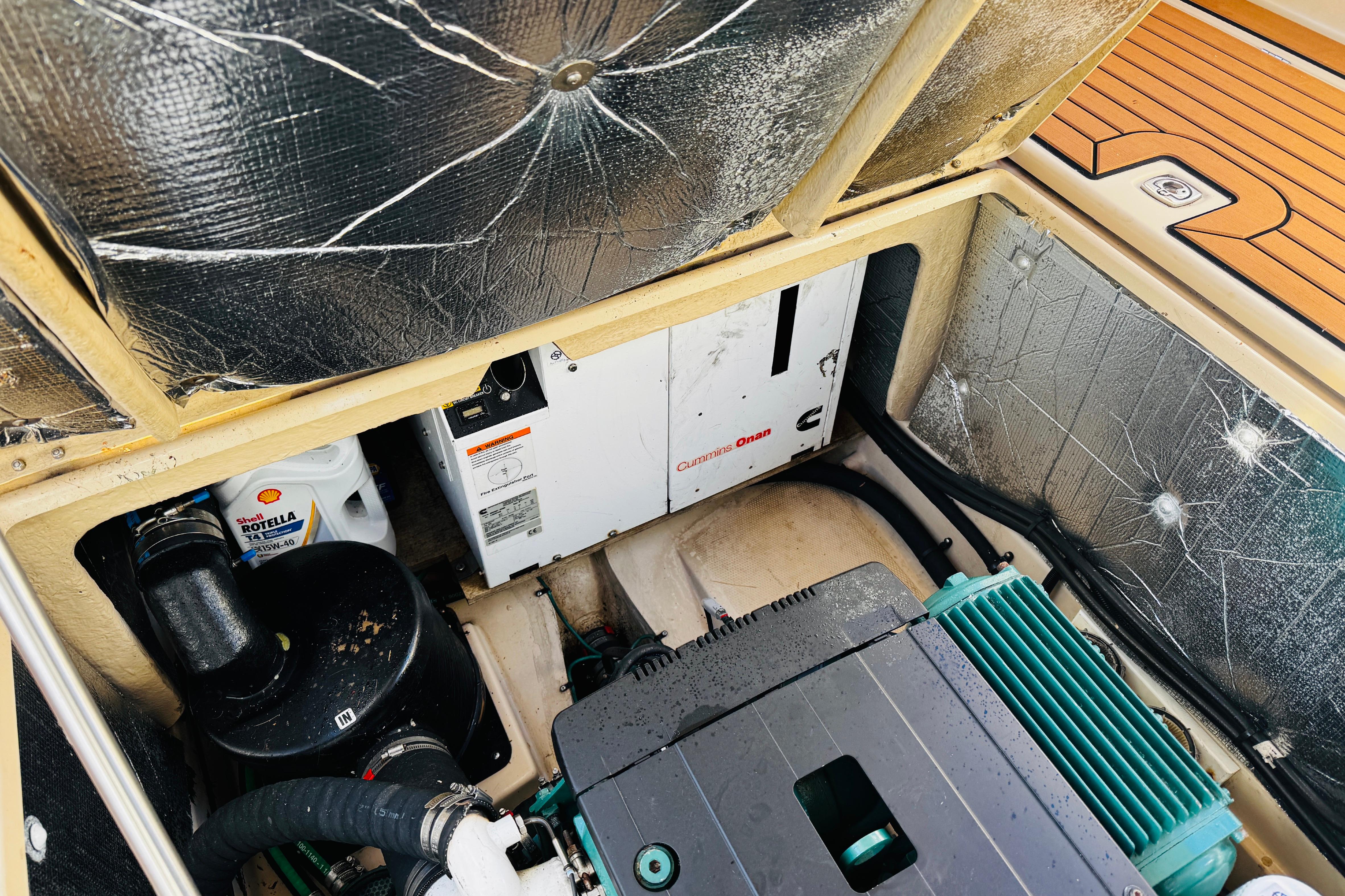 Engine compartment of a 2012 Ranger Tugs R-31 with Cummins Onan generator.