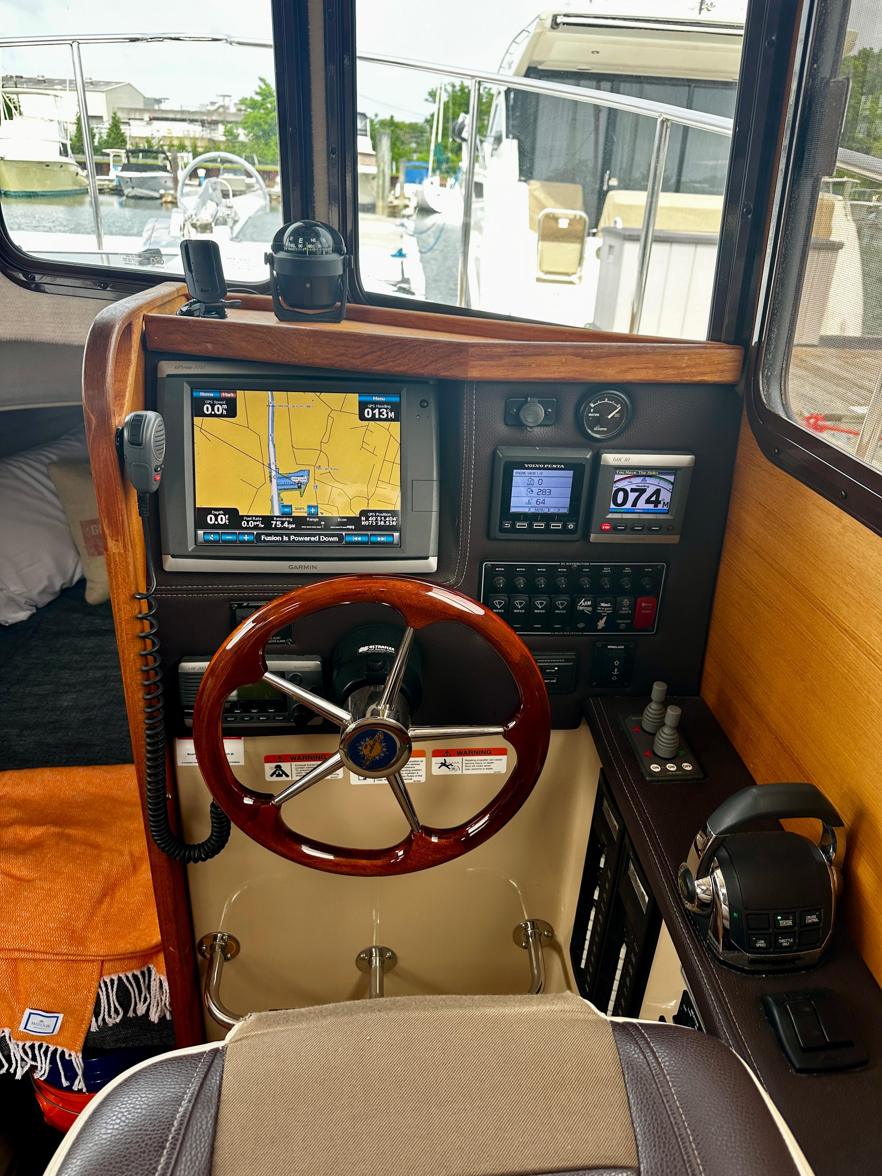 2014 American Tug R-27 helm with navigation display and controls.