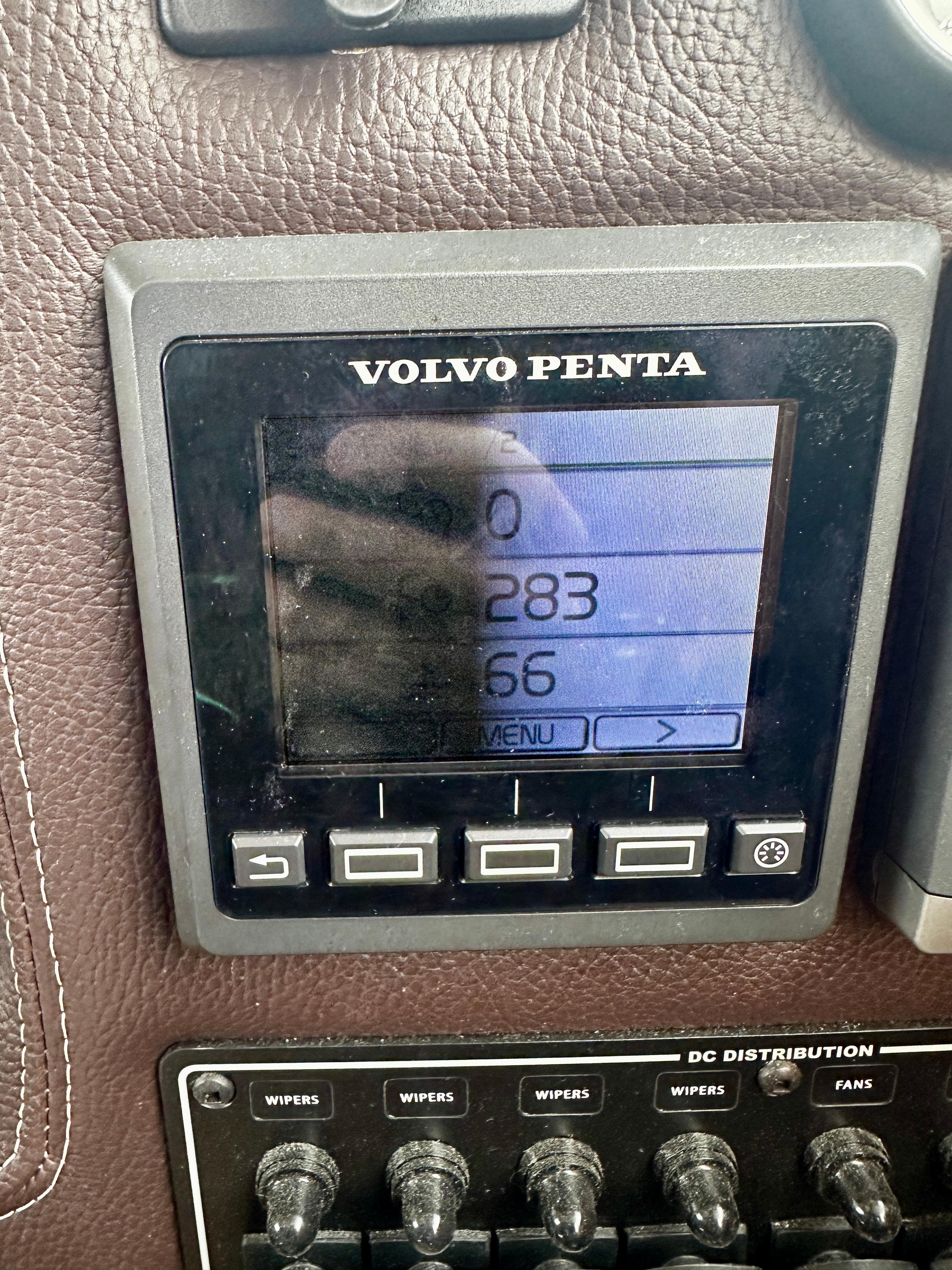 Volvo Penta display on 2014 American Tug R-27 dashboard with control switches.