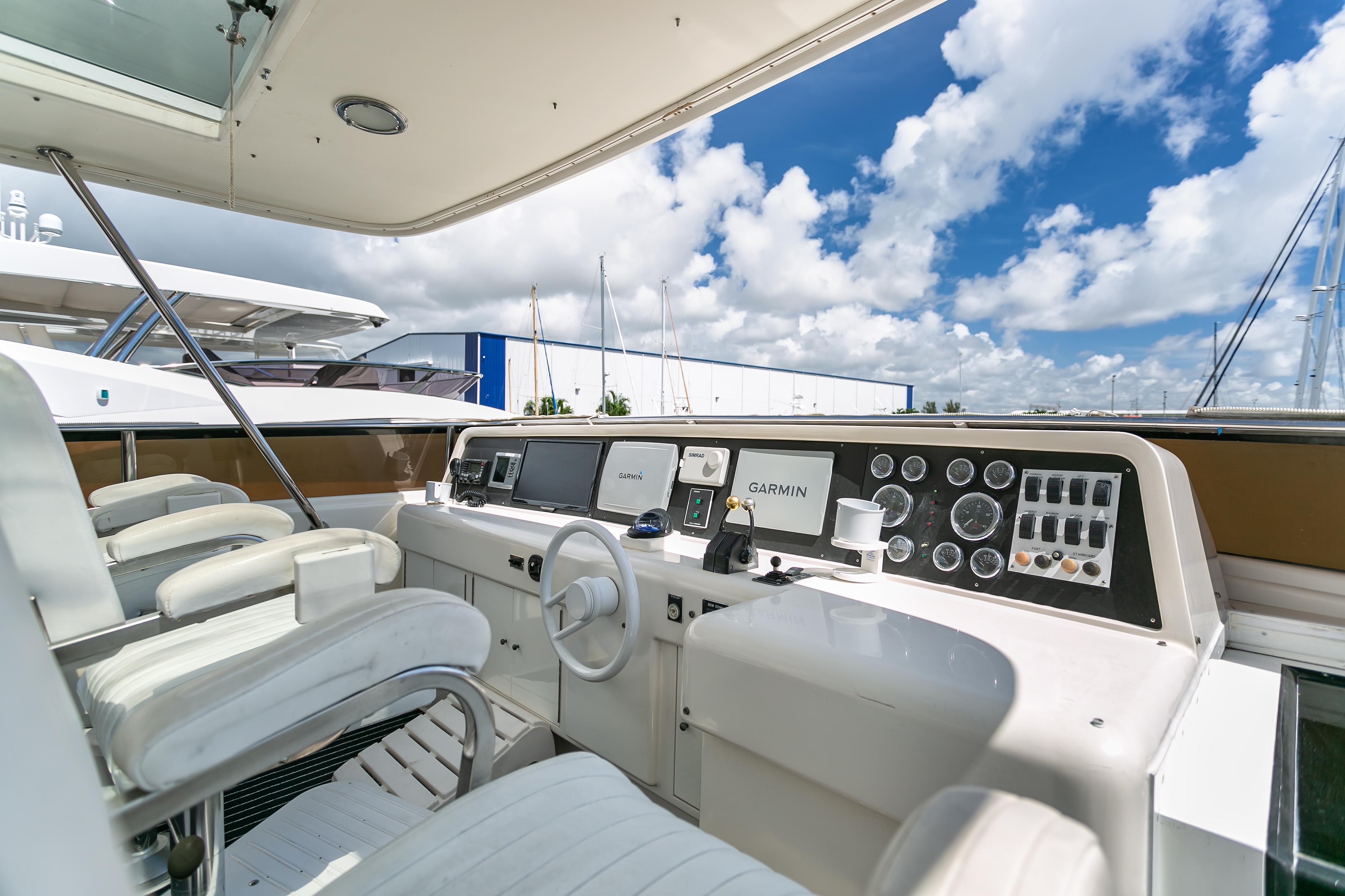 Lazzara-76 1994-MAUTICA FL-US-Lazzara 76 yacht helm, 1994 model, featuring modern navigation equipment and luxurious seating.-9595695 | Thumbnail