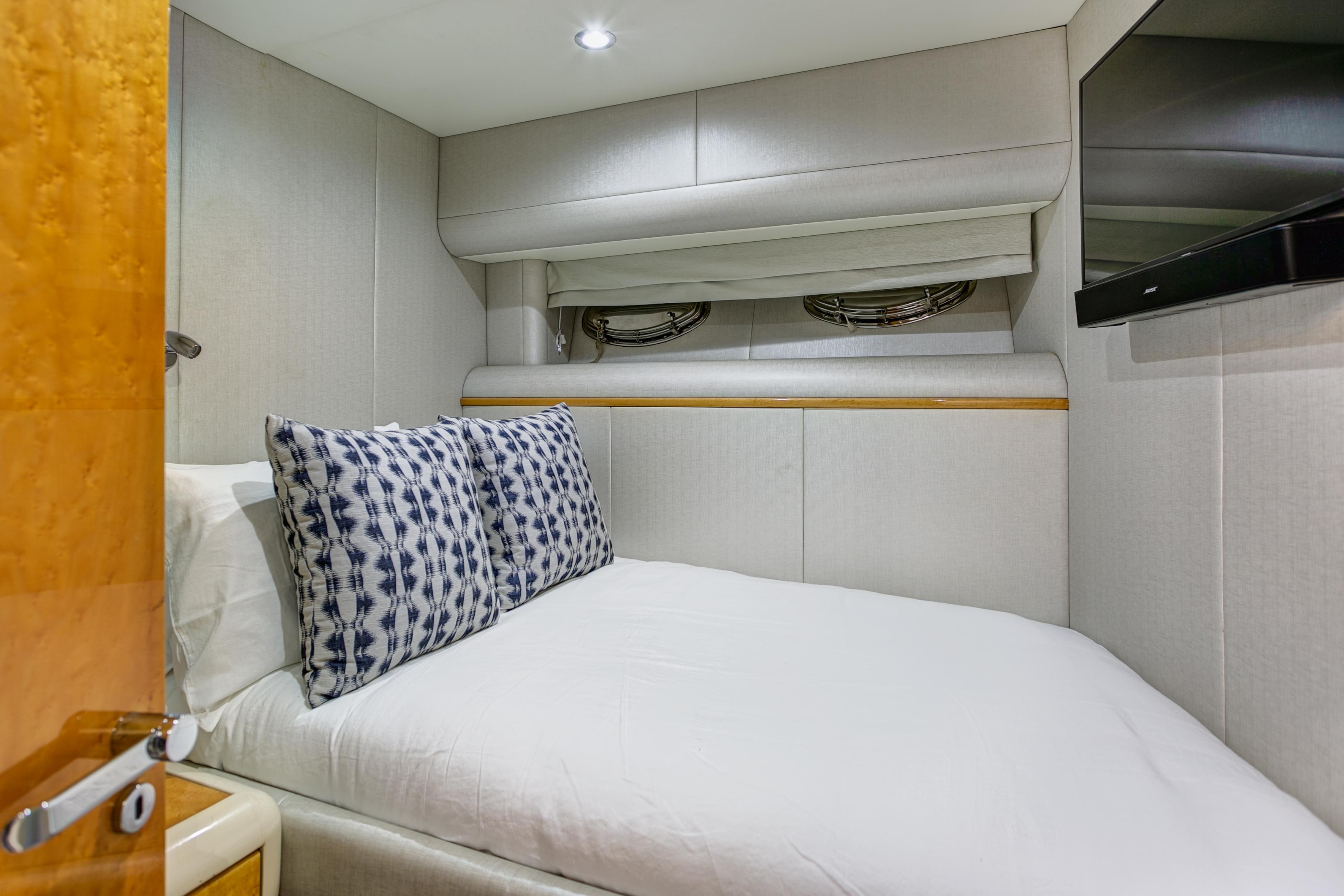 Lazzara-76 1994-MAUTICA FL-US-Cozy bedroom in 1994 Lazzara 76 yacht with modern decor and TV.-9595695 | Thumbnail