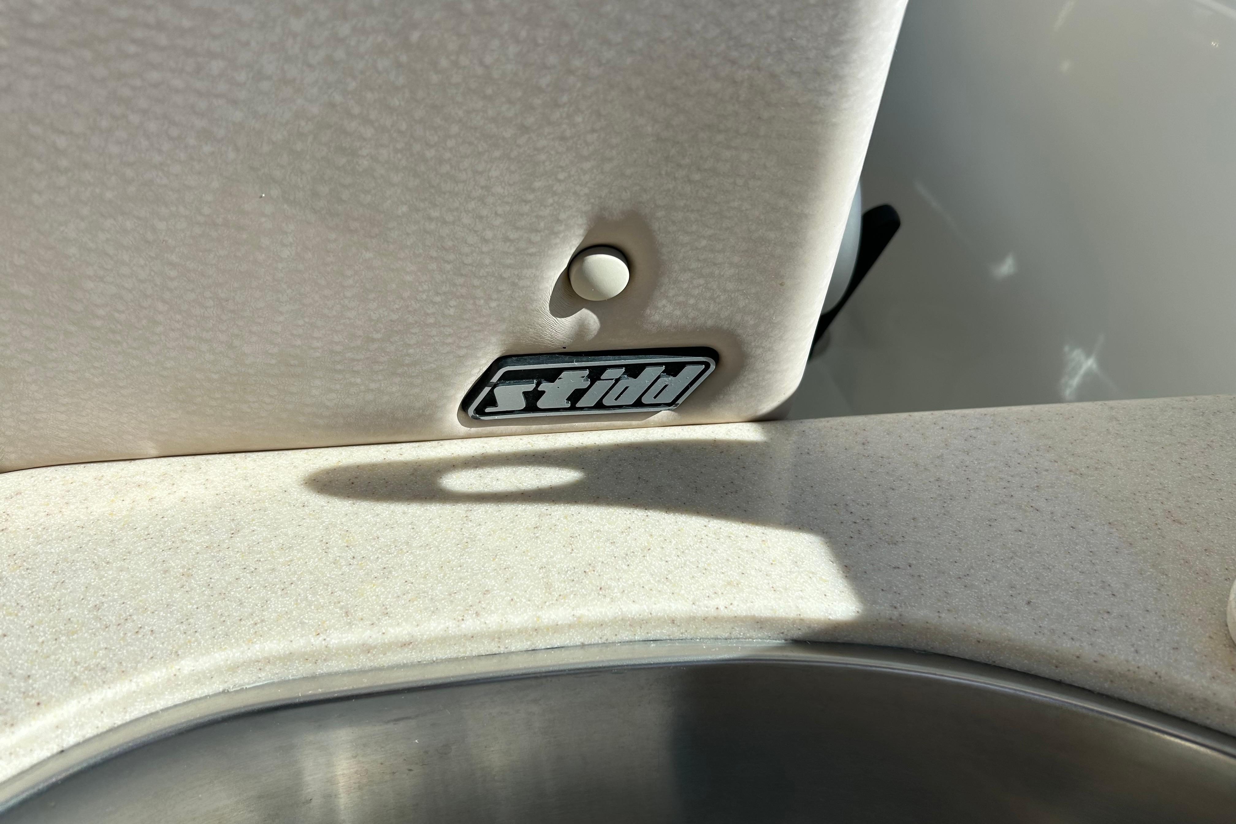 2008 Back Cove 33 boat interior detail with sink and textured surface.