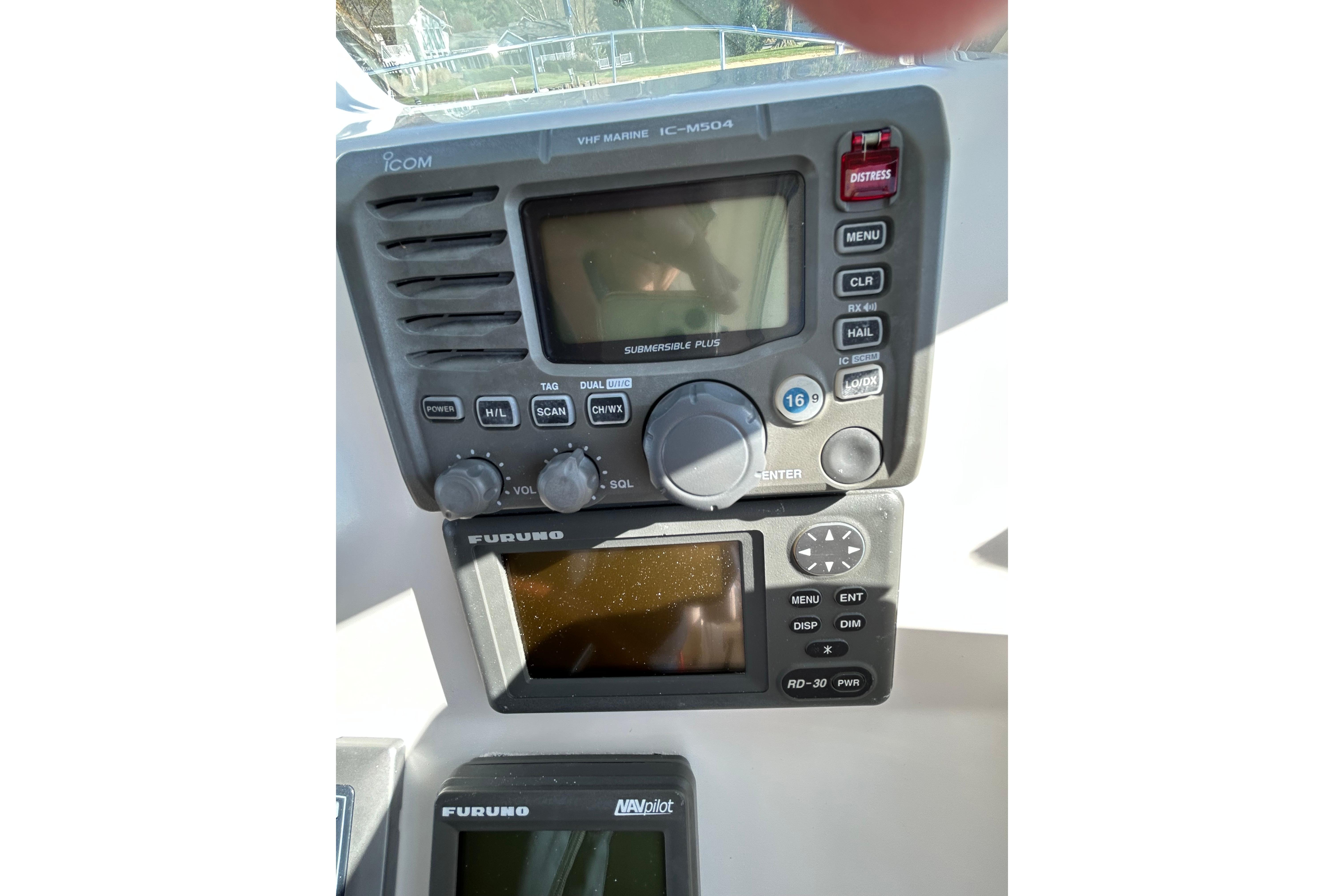 2008 Back Cove 33 boat dashboard with Icom VHF marine radio and Furuno navigation displays.