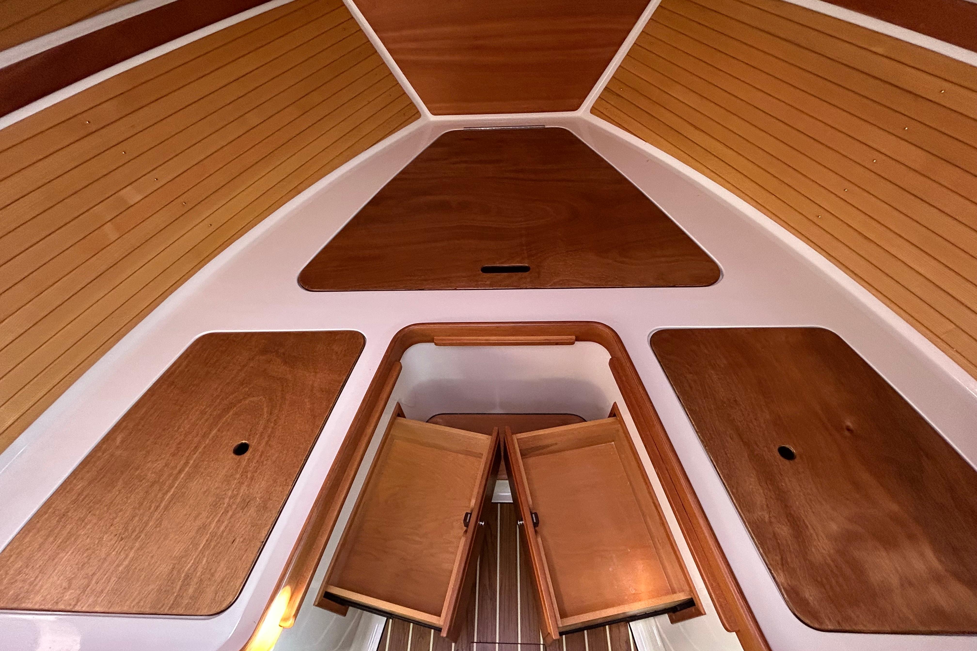 Interior view of 2008 Back Cove 33 boat with wooden cabinetry and paneling.