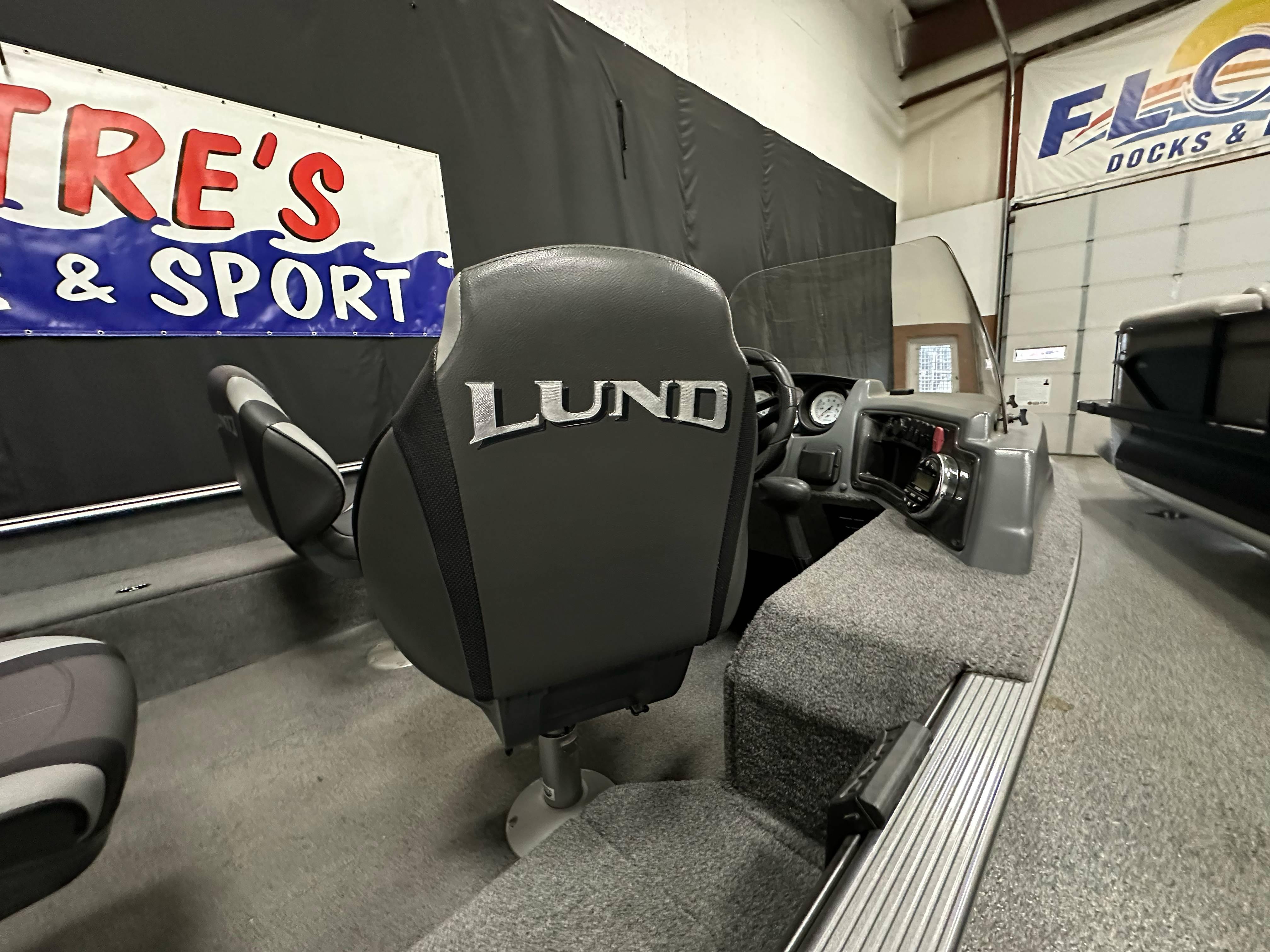 2017 Lund 1675 Impact SS boat interior with branded seat and dashboard.