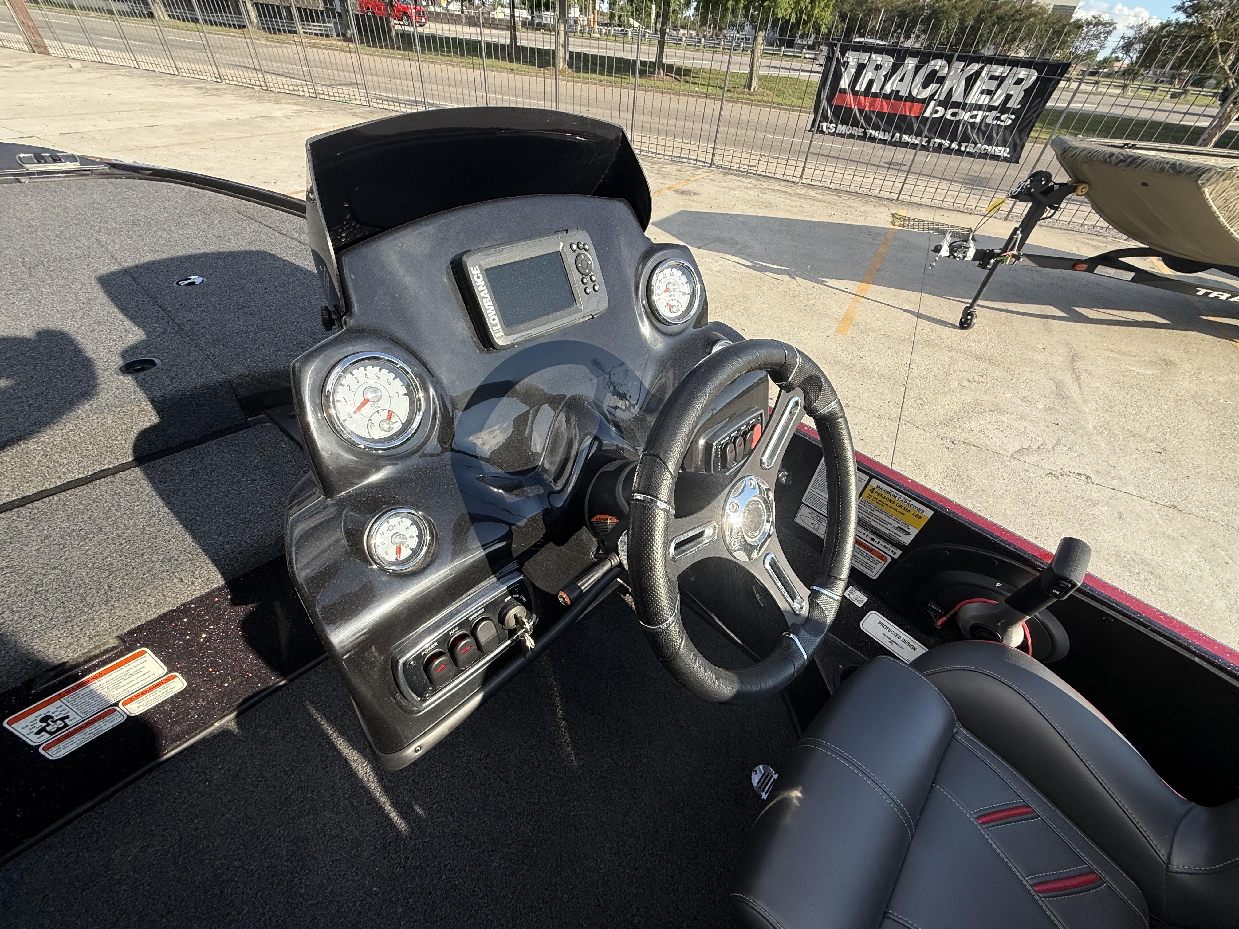 2019 Nitro Z18 DC boat dashboard with steering wheel and gauges.