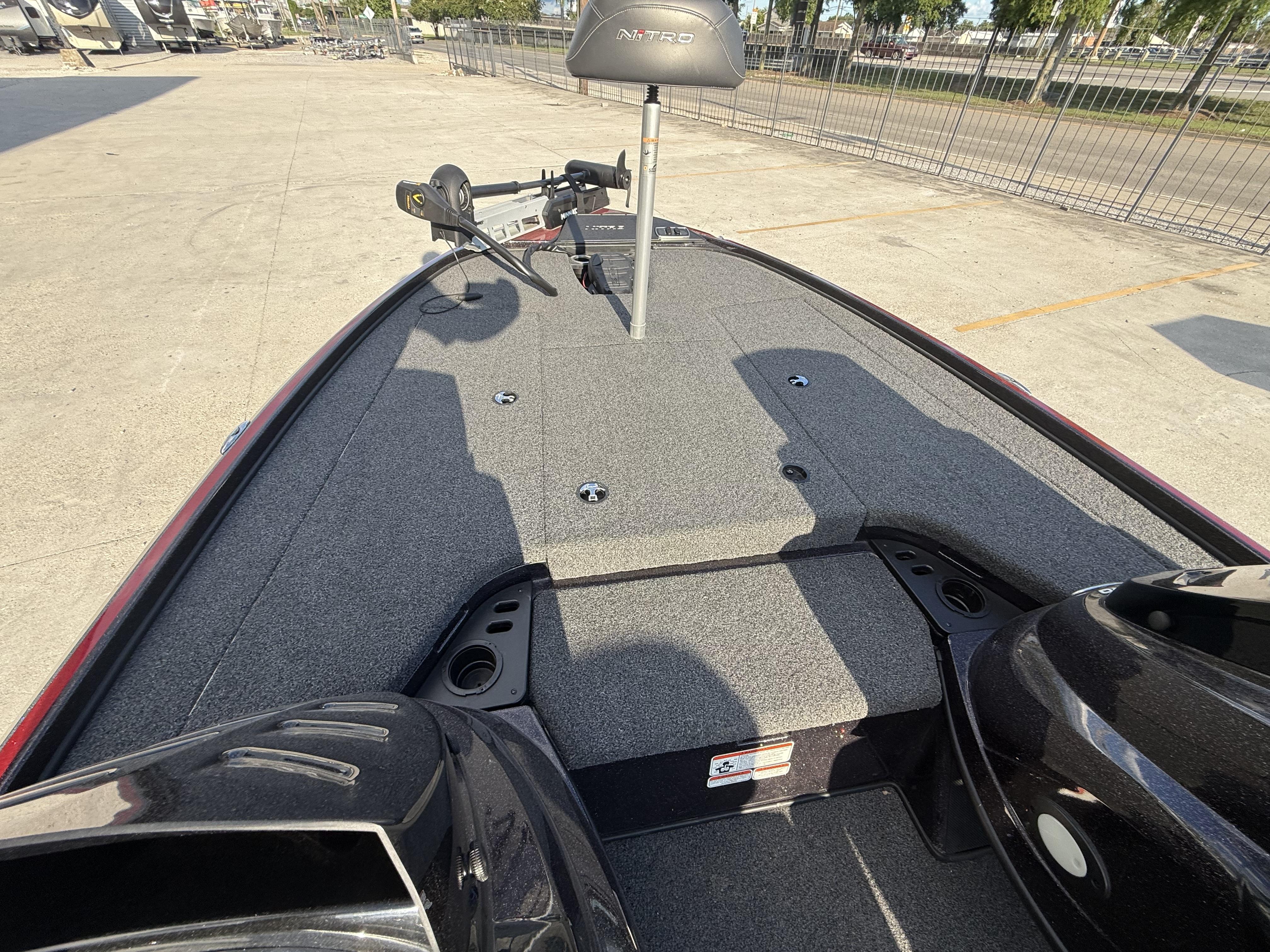 2019 Nitro Z18 DC boat deck with trolling motor, parked outdoors.