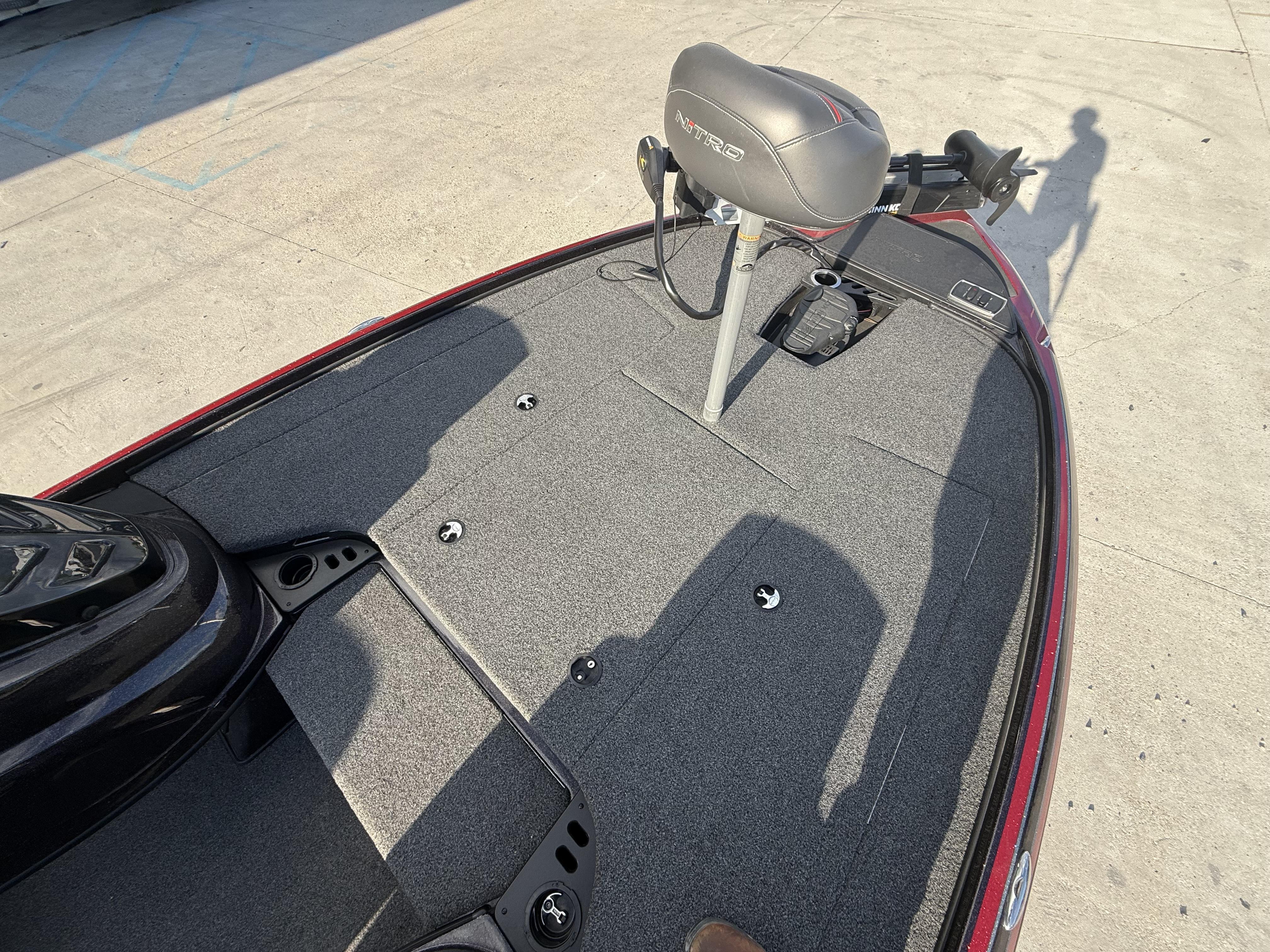2019 Nitro Z18 DC boat deck with seat and carpeted surface.