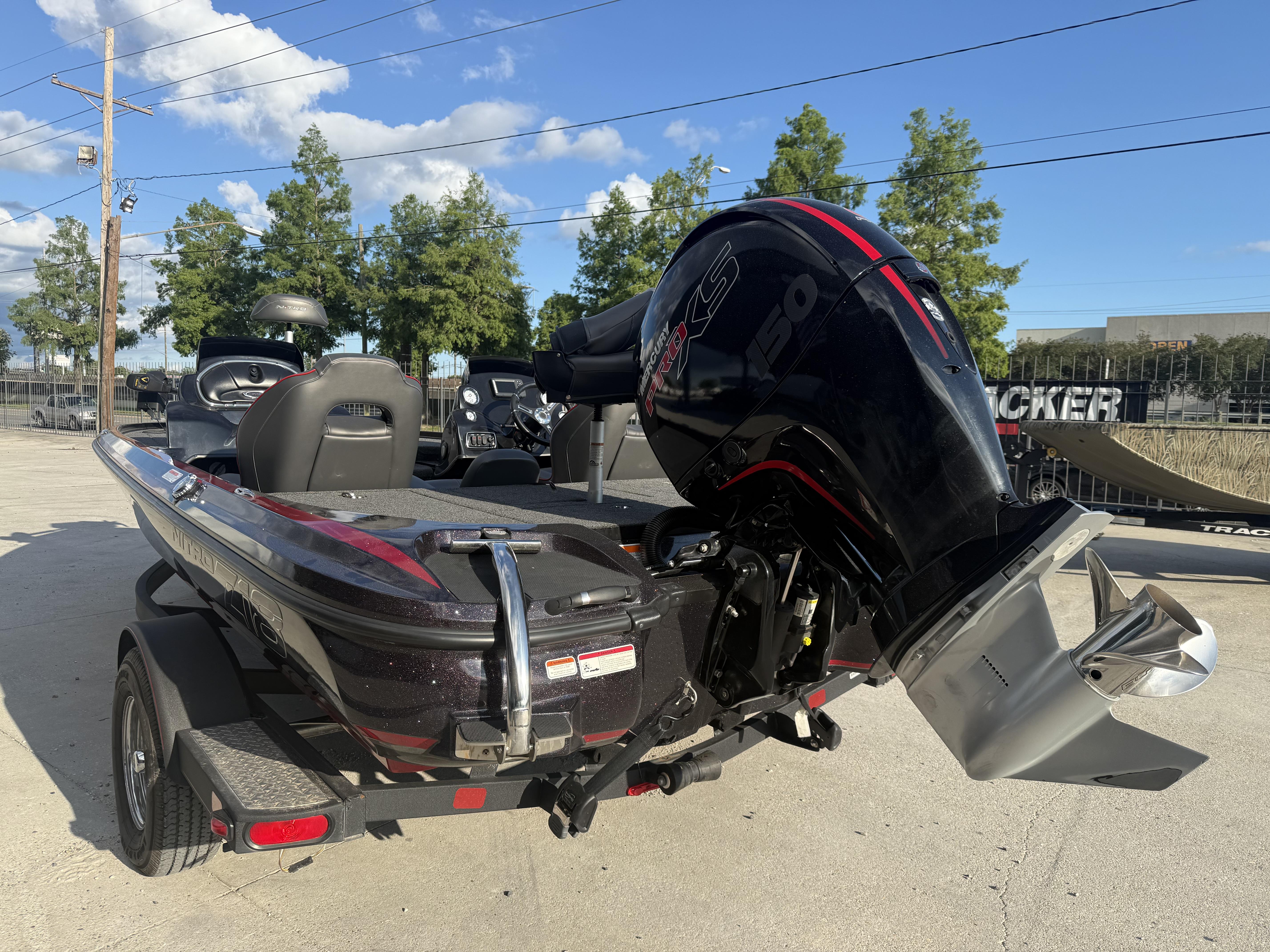 2019 Nitro Z18 DC boat with powerful outboard motor, parked outdoors on a sunny day.