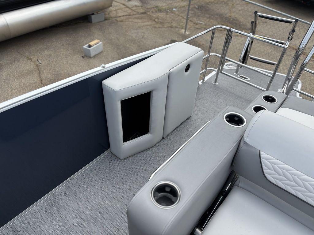 2025 Godfrey Monaco 235 DFL boat interior with gray seating and cup holders.