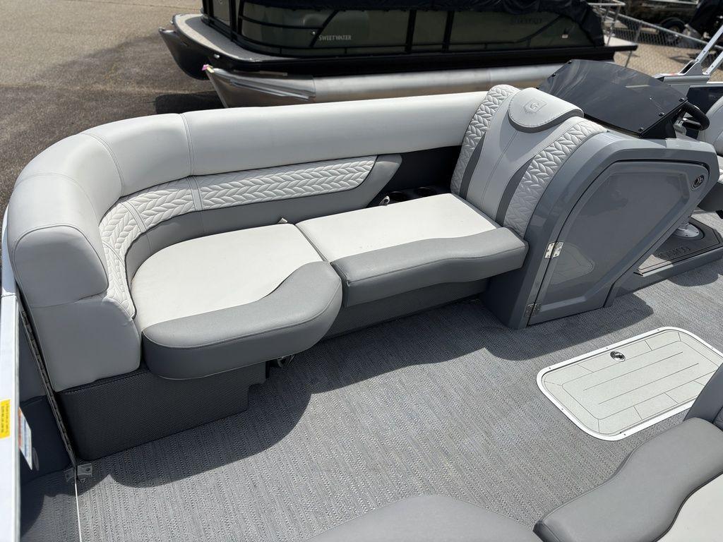 Luxurious seating on 2025 Godfrey Monaco 235 DFL pontoon boat, featuring elegant gray upholstery.