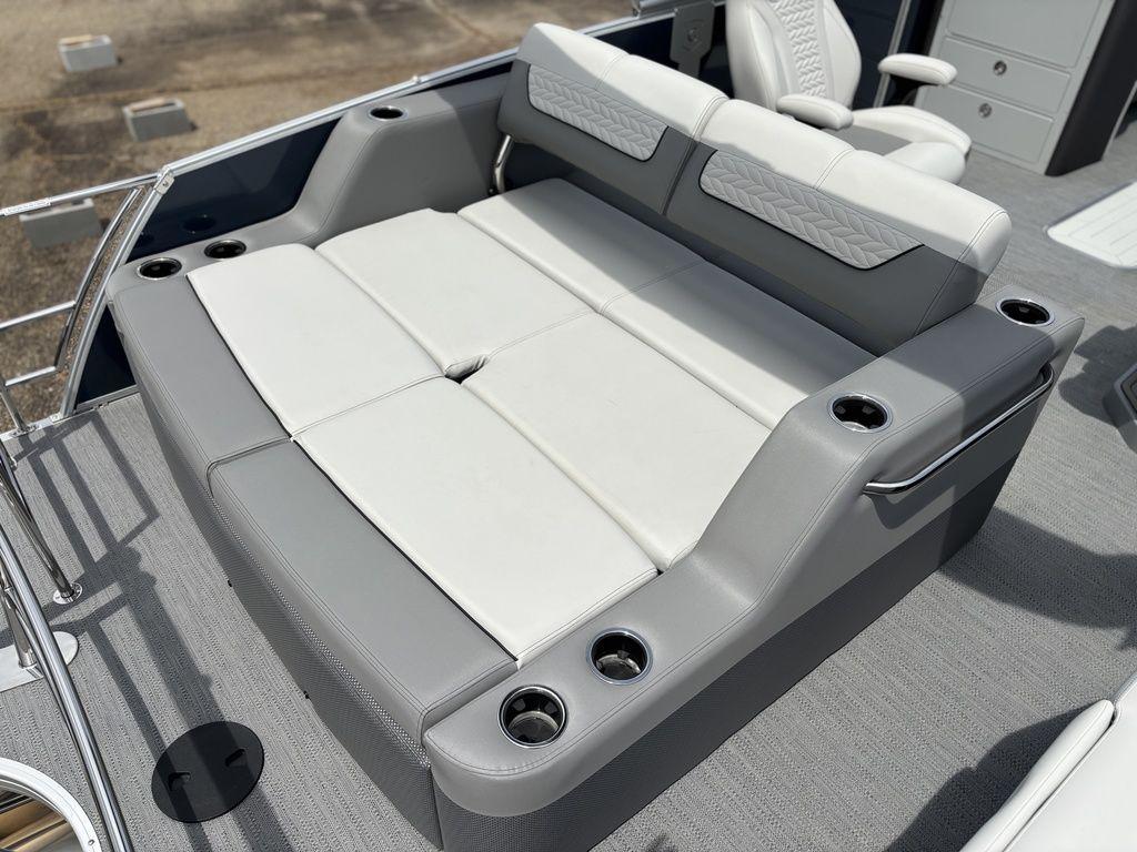 Luxurious seating on 2025 Godfrey Monaco 235 DFL boat with cup holders and modern design.